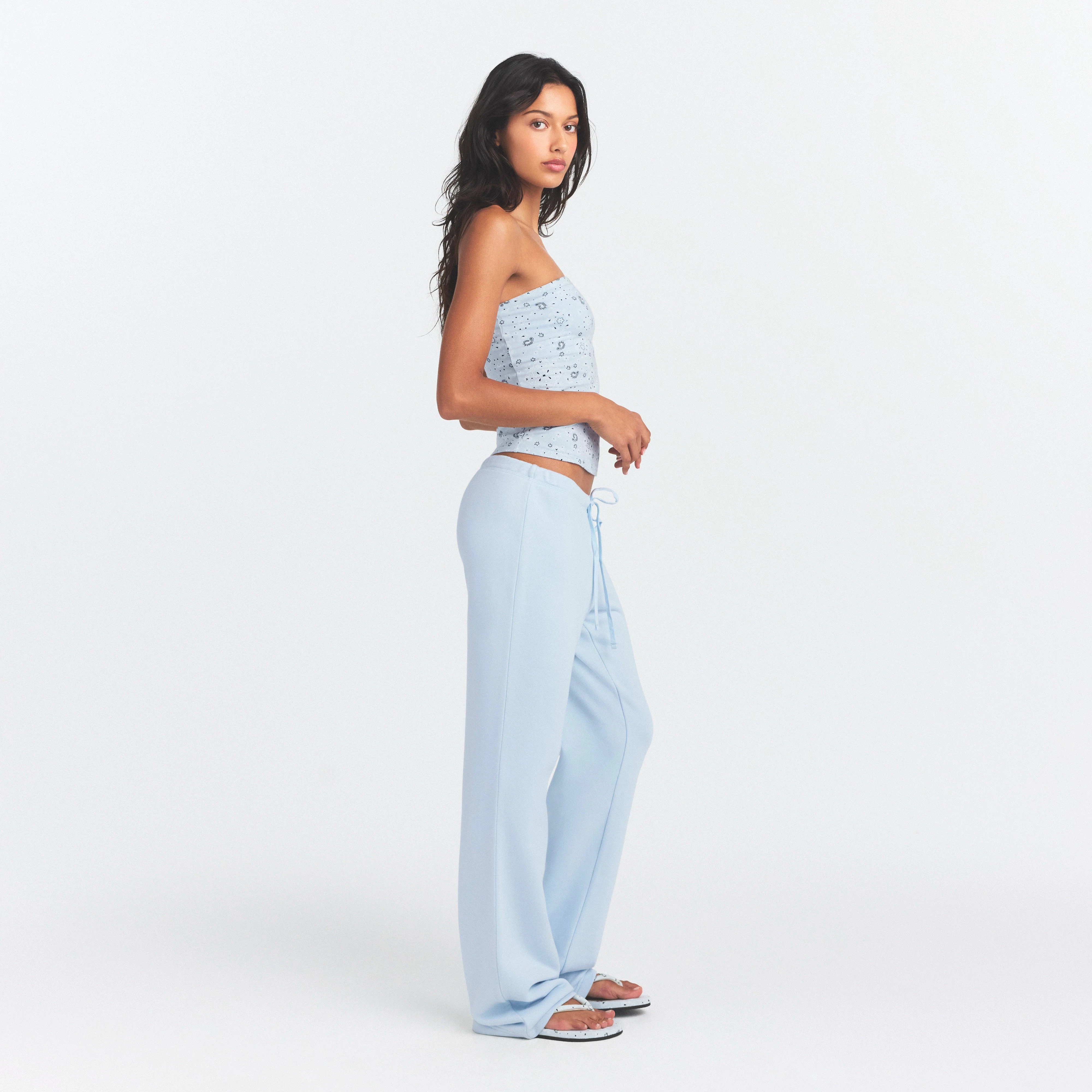 DRAPEY FRENCH TERRY STRAIGHT LEG PANT | POWDER BLUE ON A MODEL SIDE VIEW @ | FOCUS: 0.0, 1.0, 0.9