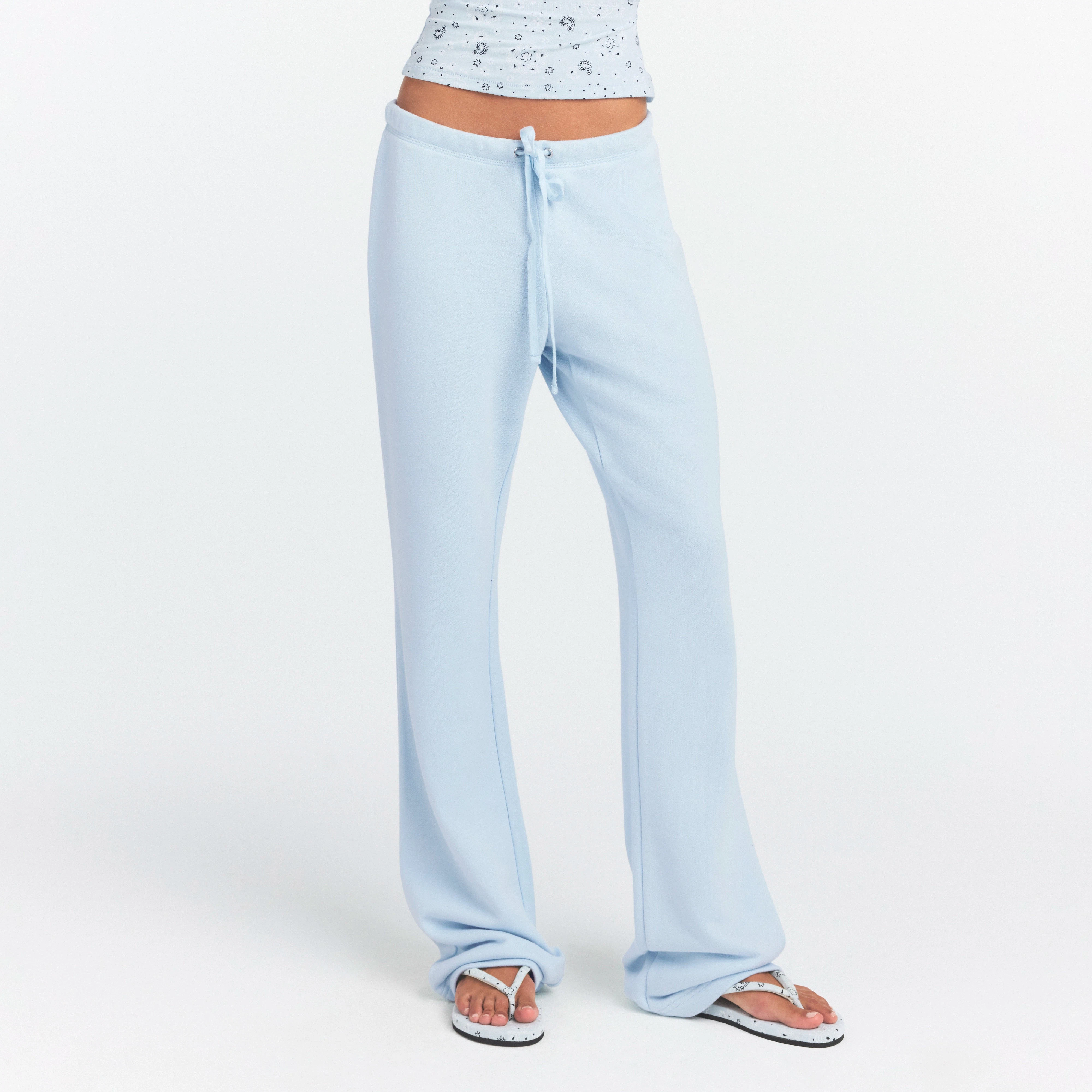 DRAPEY FRENCH TERRY STRAIGHT LEG PANT | POWDER BLUE ON A MODEL SIDE VIEW @ | FOCUS: 0.0, 1.0, 0.9