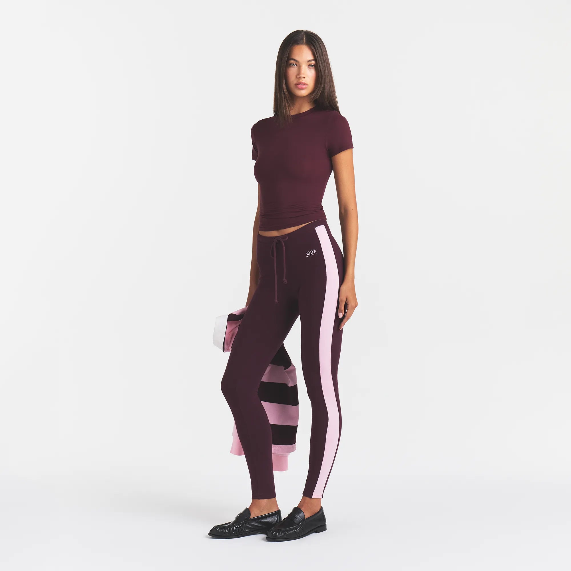 OUTDOOR HIGH WAISTED LEGGING | CURRANT PEONY CONTRAST & LAYS FLAT ON A WHITE BACKGROUND | FLT @ | FOCUS: 0.0, 1.0, 0.9