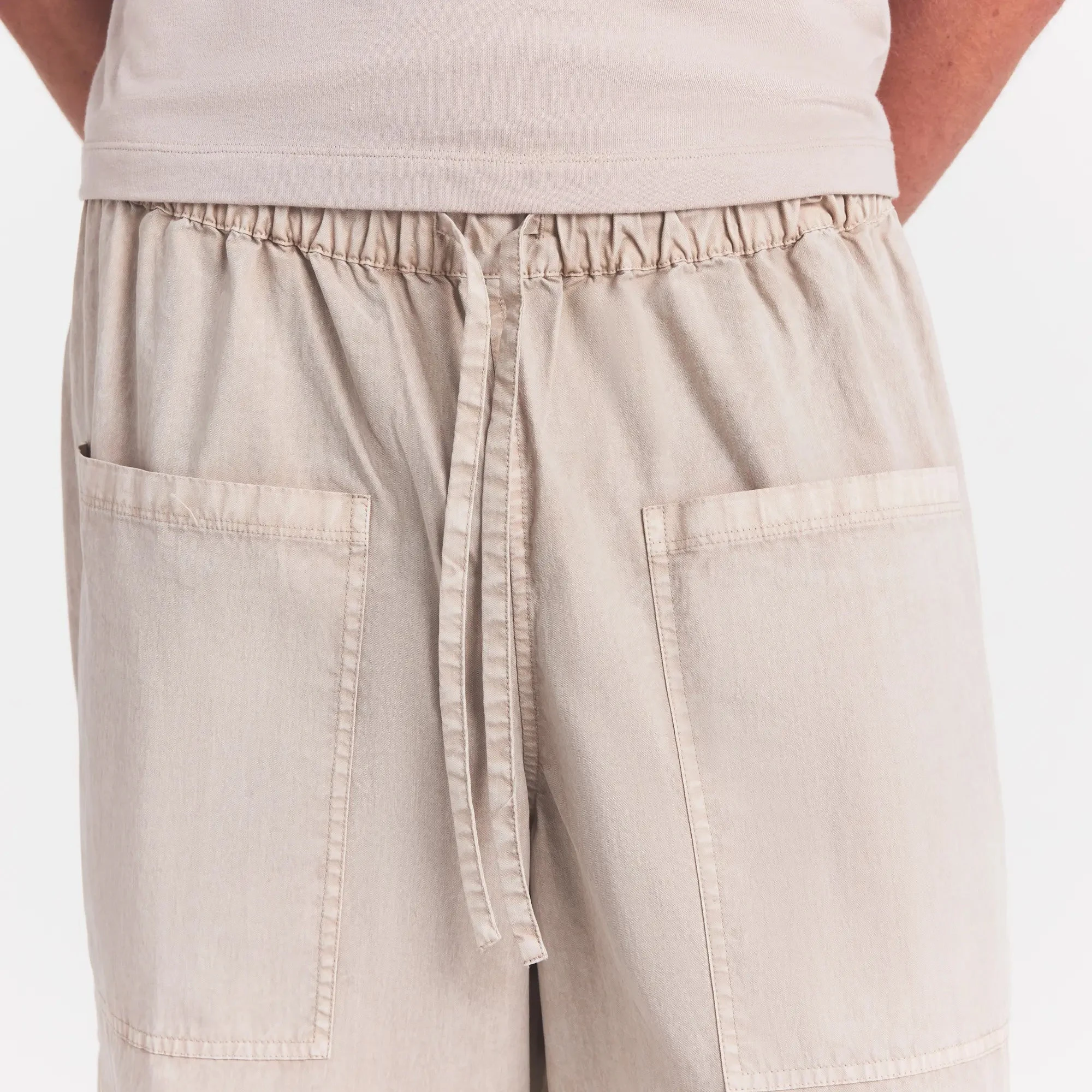 WOVEN MENS CARGO PANT | STONE ON A MODEL SIDE VIEW @ | FOCUS: 0.0, 1.0, 0.9