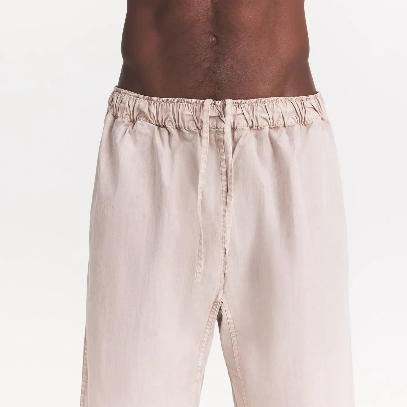 WOVEN MENS KARATE PANT | STONE ON A MODEL SIDE VIEW