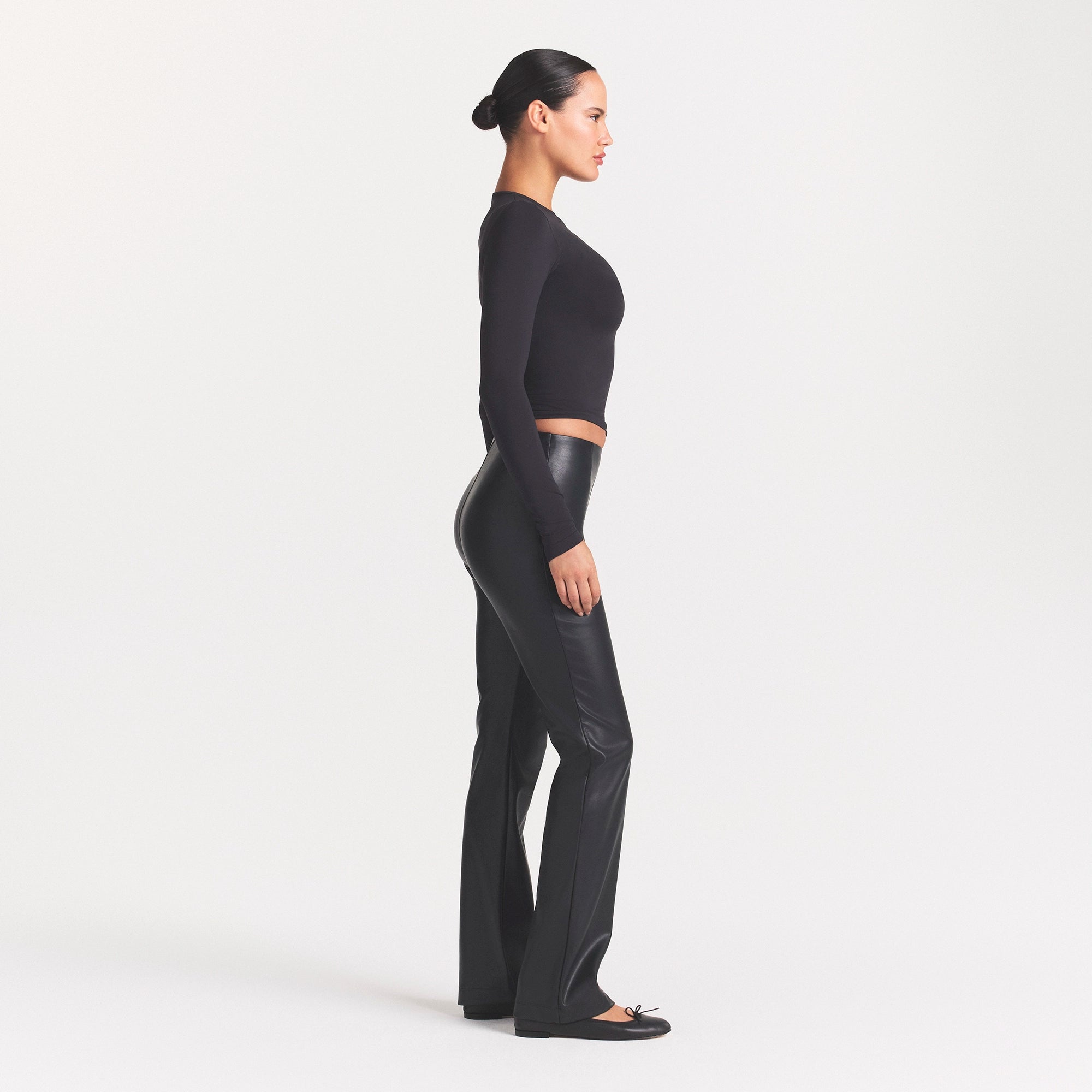 FAUX LEATHER PANT | ONYX ON A MODEL FRONT VIEW @ | FOCUS: 0.0, 1.0, 0.9