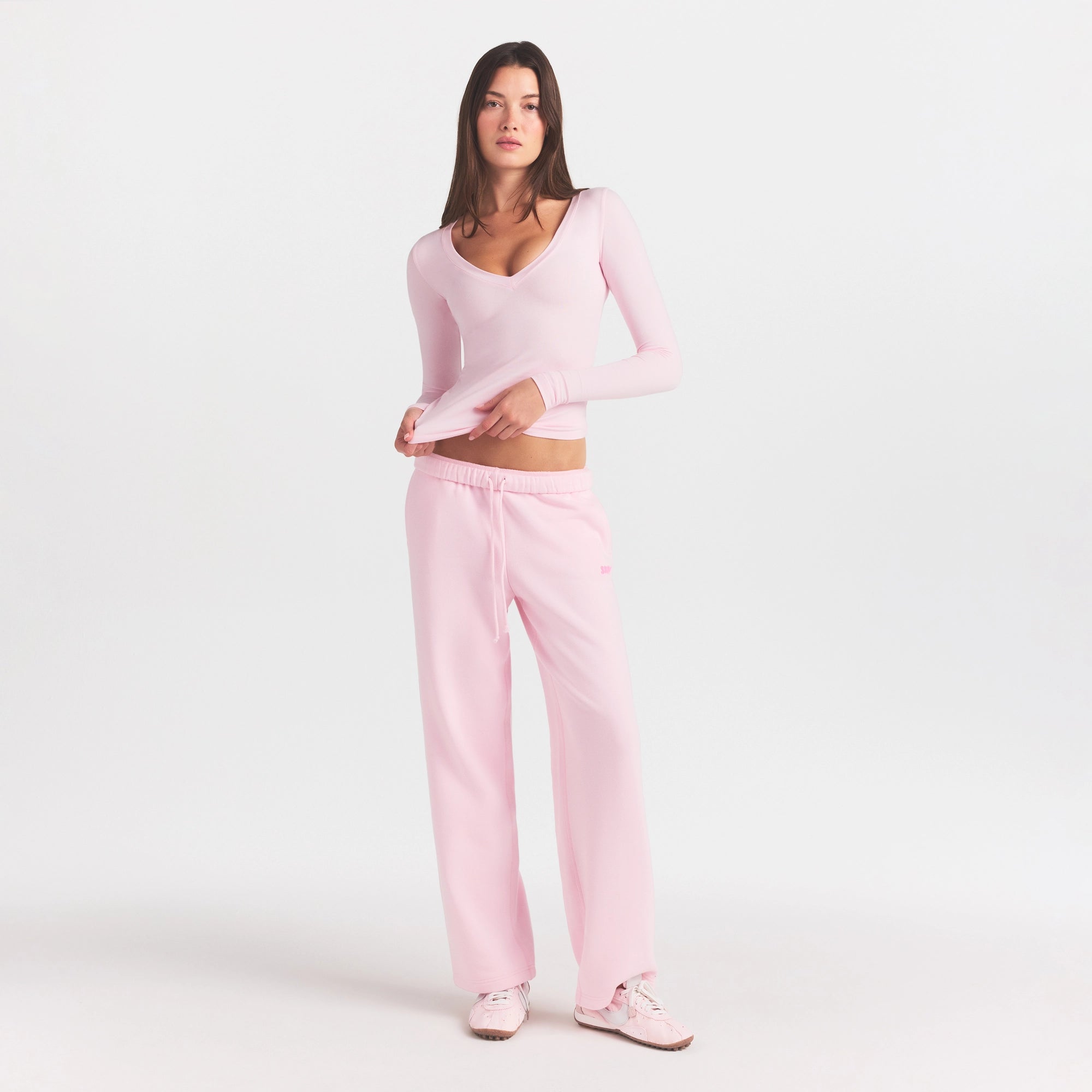 COTTON FLEECE STRAIGHT LEG PANT WITH EMBOSSED LOGO | CHERRY BLOSSOM ON A MODEL FRONT VIEW @ | FOCUS: 0.0, 1.0, 0.9