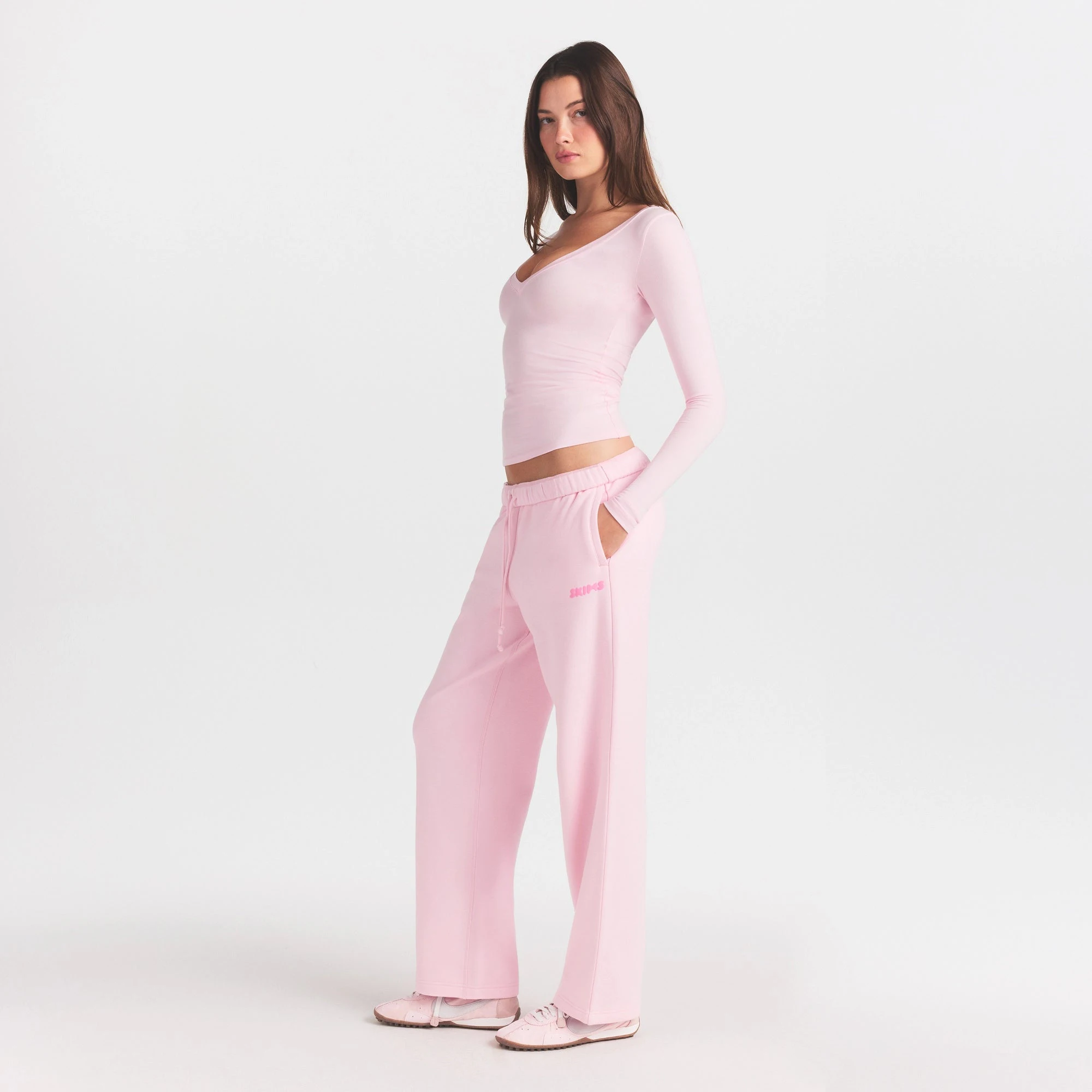 COTTON FLEECE STRAIGHT LEG PANT WITH EMBOSSED LOGO | CHERRY BLOSSOM ON A MODEL FRONT VIEW @ | FOCUS: 0.0, 1.0, 0.9