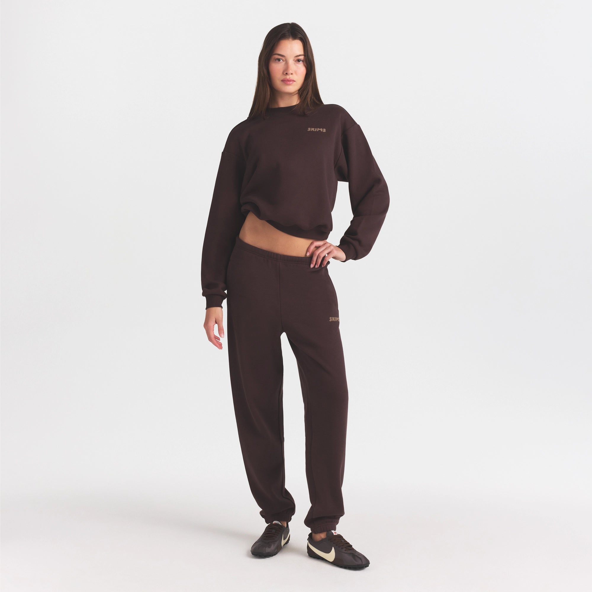 COTTON FLEECE JOGGER WITH EMBOSSED LOGO | ESPRESSO ON A MODEL FRONT VIEW @ | FOCUS: 0.0, 1.0, 0.9