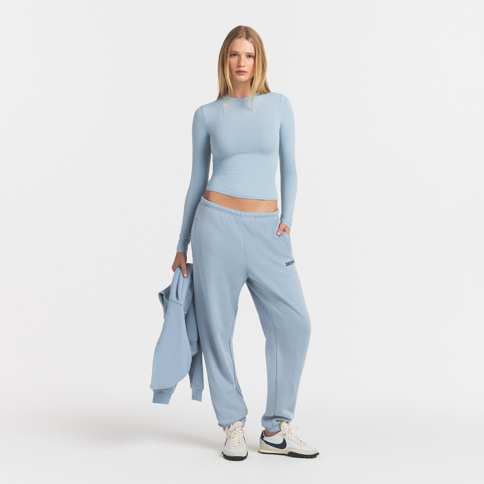 COTTON FLEECE JOGGER WITH EMBOSSED LOGO | FOG & LAYS FLAT ON A WHITE BACKGROUND | FLT @ | FOCUS: 0.0, 1.0, 0.9