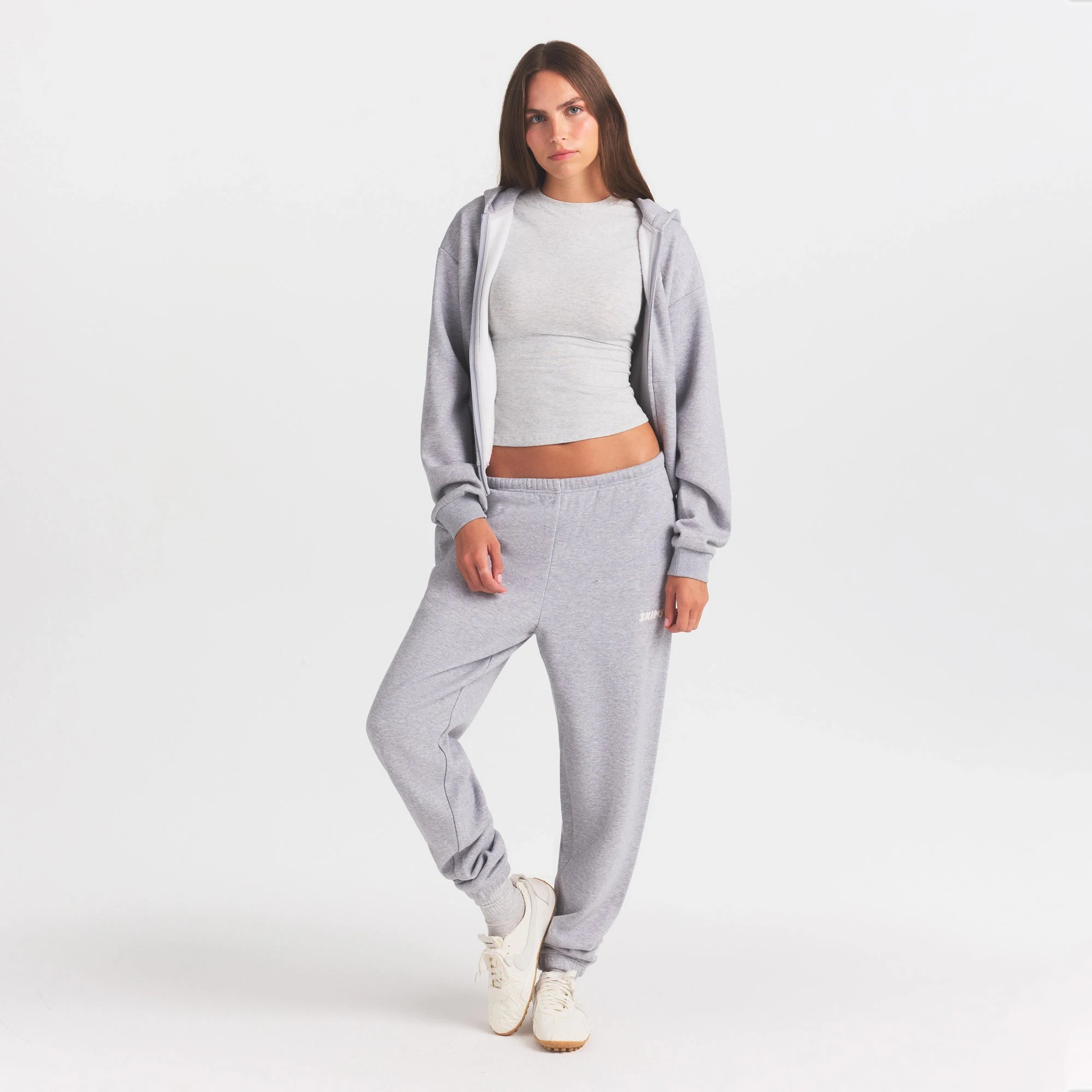 COTTON FLEECE JOGGER WITH EMBOSSED LOGO | HEATHER GREY ON A MODEL FRONT VIEW @ | FOCUS: 0.0, 1.0, 0.9