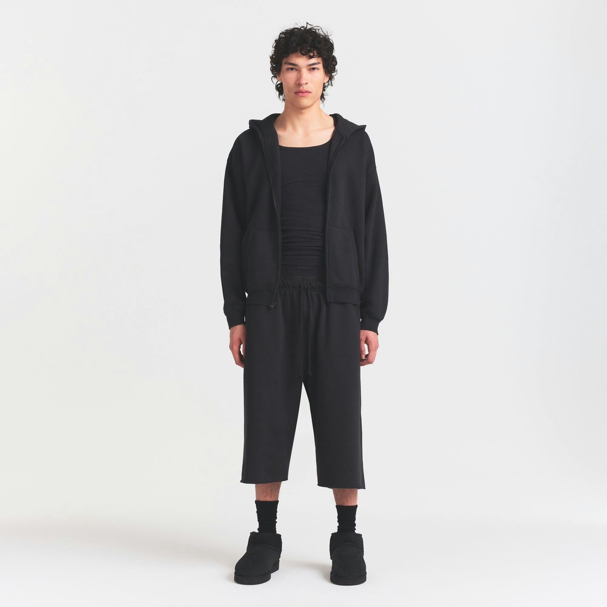 FLEECE LOUNGE MENS RELAXED LONG SHORT | WASHED ONYX ON A MODEL FRONT VIEW @ | FOCUS: 0.0, 1.0, 0.9