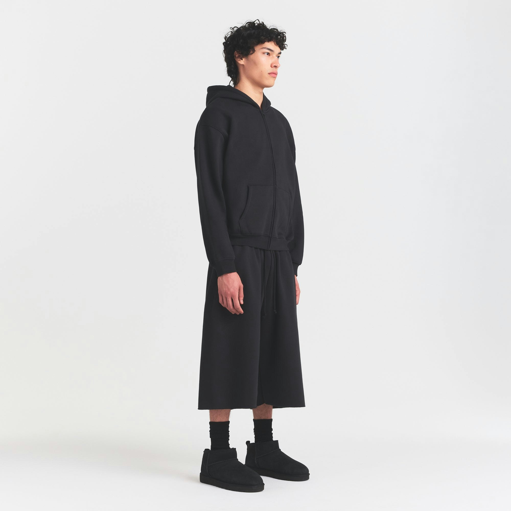 FLEECE LOUNGE MENS RELAXED LONG SHORT | WASHED ONYX ON A MODEL FRONT VIEW @ | FOCUS: 0.0, 1.0, 0.9