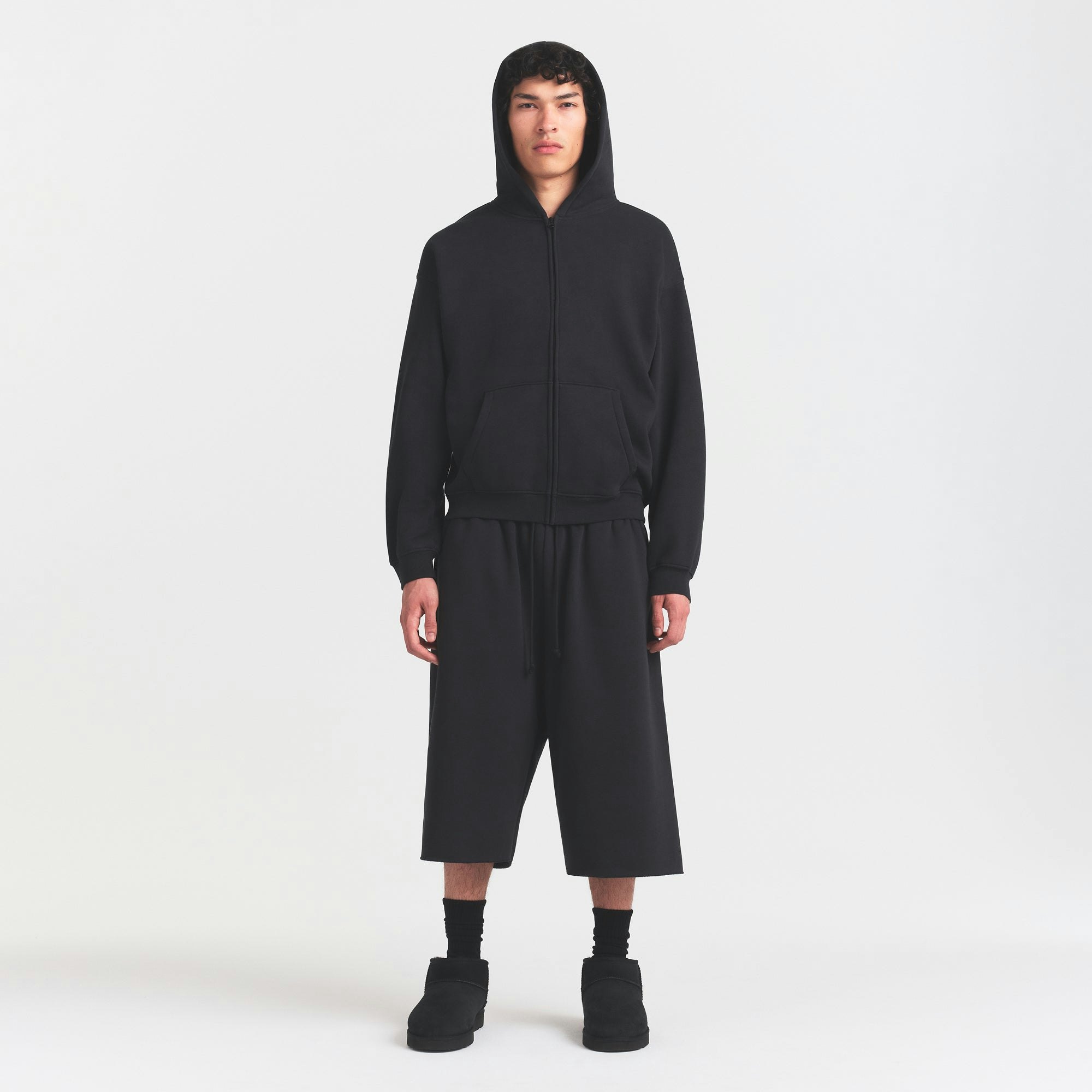 FLEECE LOUNGE MENS RELAXED LONG SHORT | WASHED ONYX ON A MODEL FRONT VIEW @ | FOCUS: 0.0, 1.0, 0.9