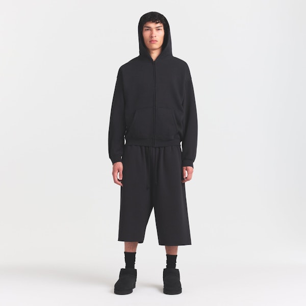 FLEECE LOUNGE MENS RELAXED LONG SHORT | WASHED ONYX ON A MODEL FRONT VIEW @ | FOCUS: 0.0, 1.0, 0.9