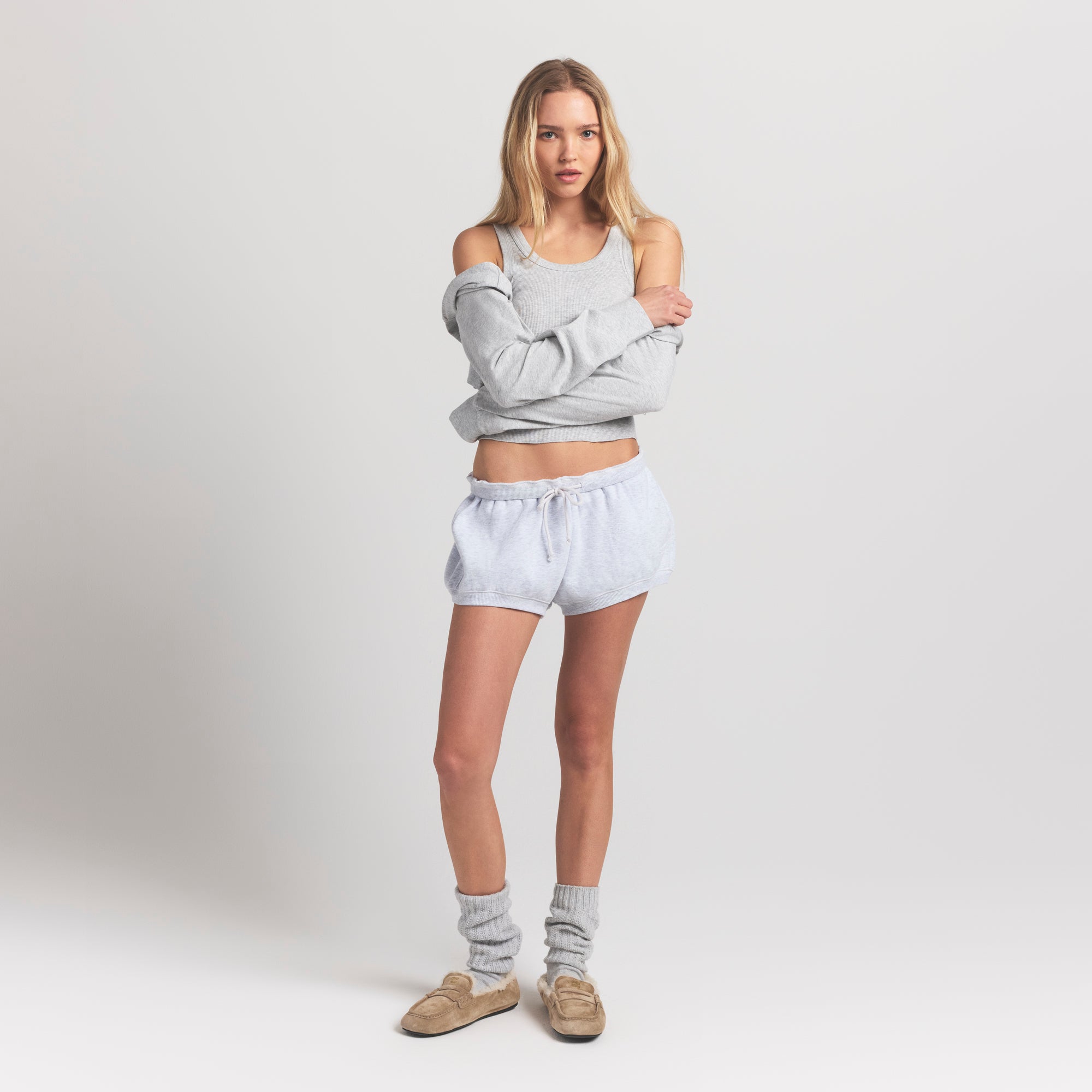 COTTON FLEECE BUBBLE HEM SHORT | LIGHT HEATHER GREY ON A MODEL FRONT VIEW @ | FOCUS: 0.9, 0.1, 0.7