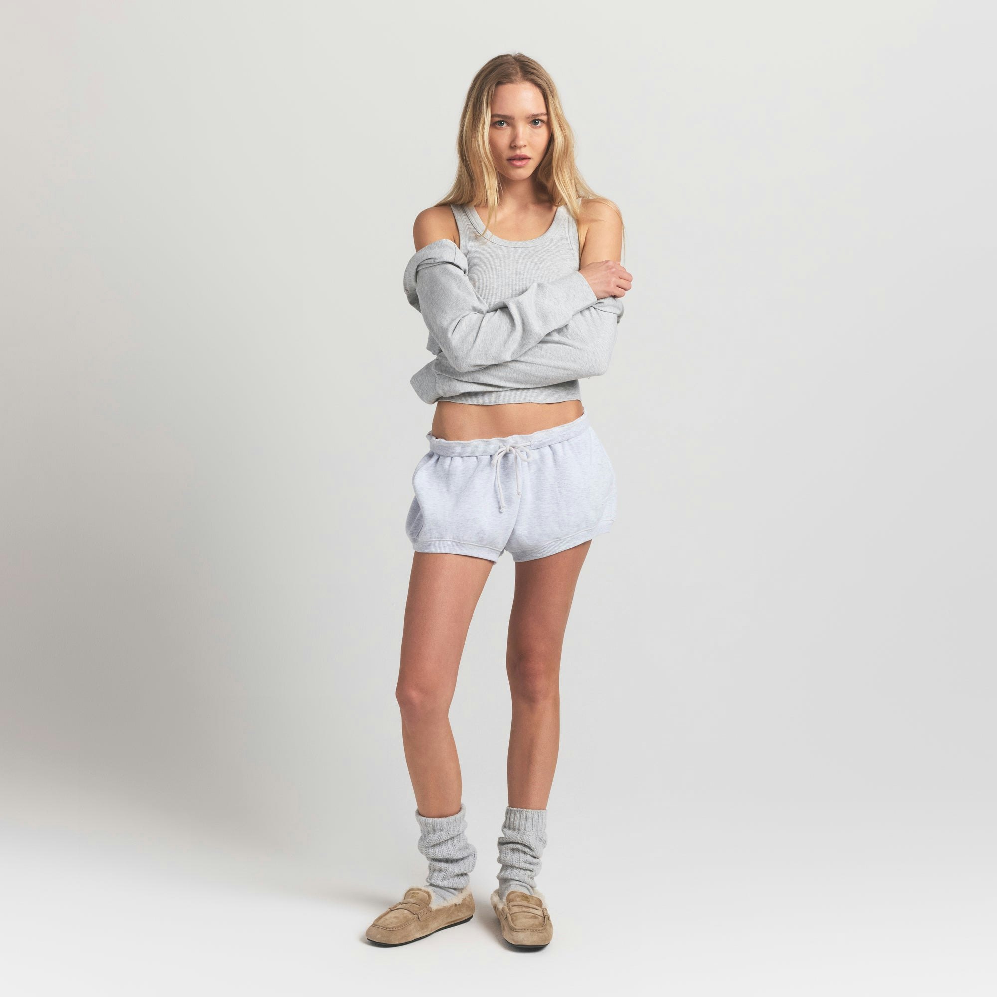 COTTON FLEECE BUBBLE HEM SHORT | LIGHT HEATHER GREY ON A MODEL FRONT VIEW S | FOCUS: 0.0, 1.0, 0.9