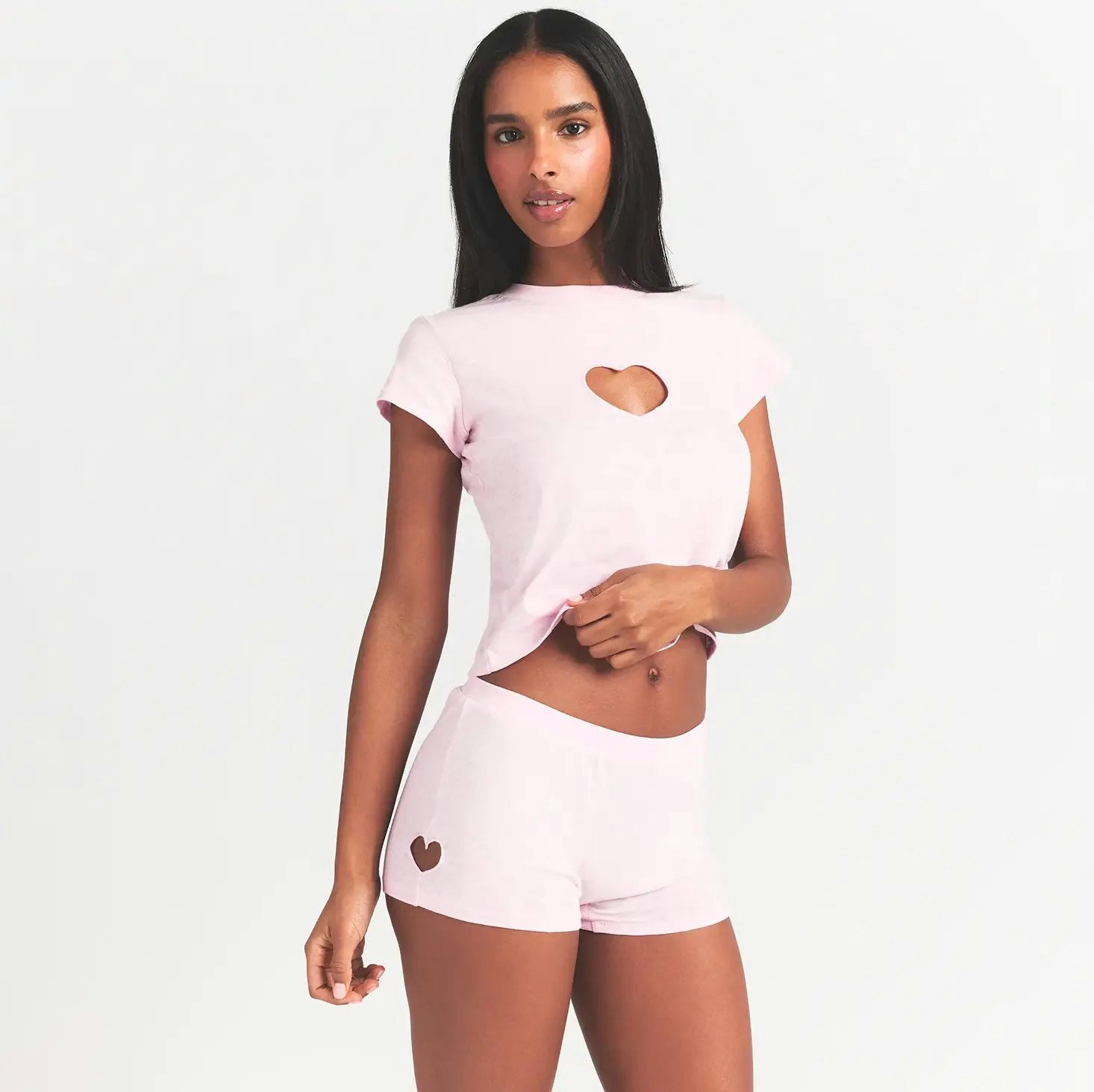 WORN IN JERSEY MICRO HEART SHORT | BABY PINK ON A MODEL FRONT VIEW @ | FOCUS: 0.0, 1.0, 0.9