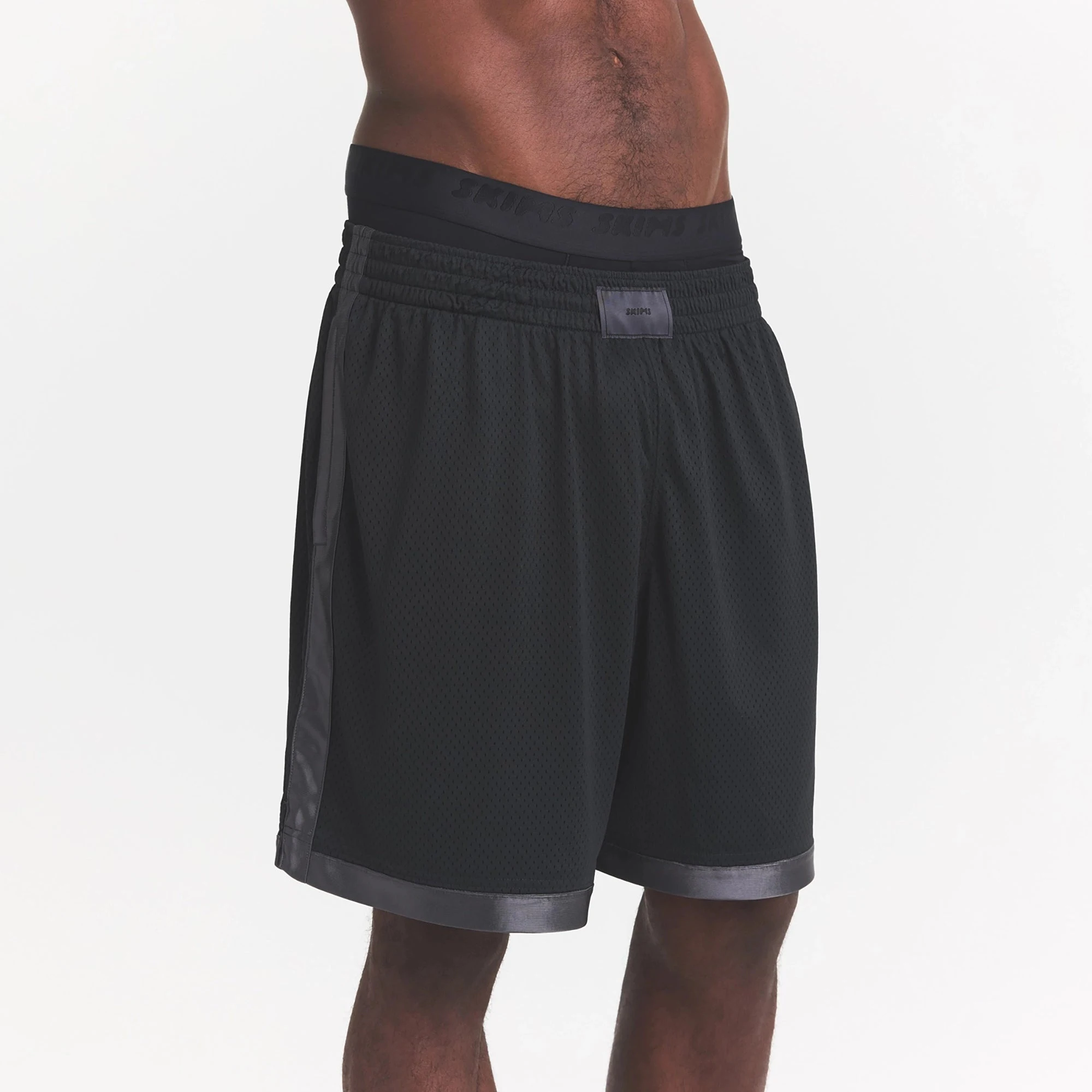 MESH APPAREL MENS SHORT | ONYX ON A MODEL SIDE VIEW @ | FOCUS: 0.0, 1.0, 0.9