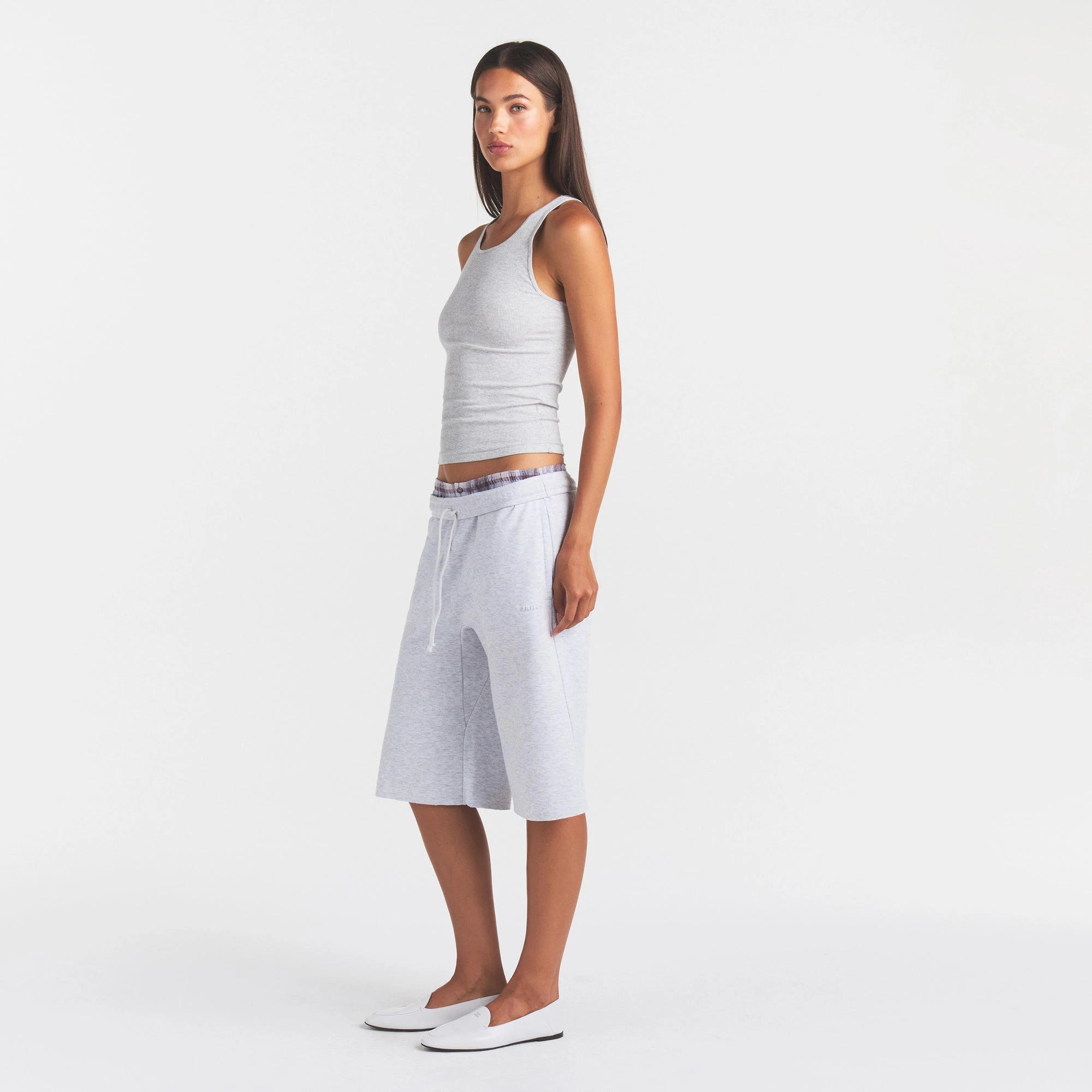 COTTON FLEECE LONG SHORT | LIGHT HEATHER GREY ON A MODEL FRONT VIEW