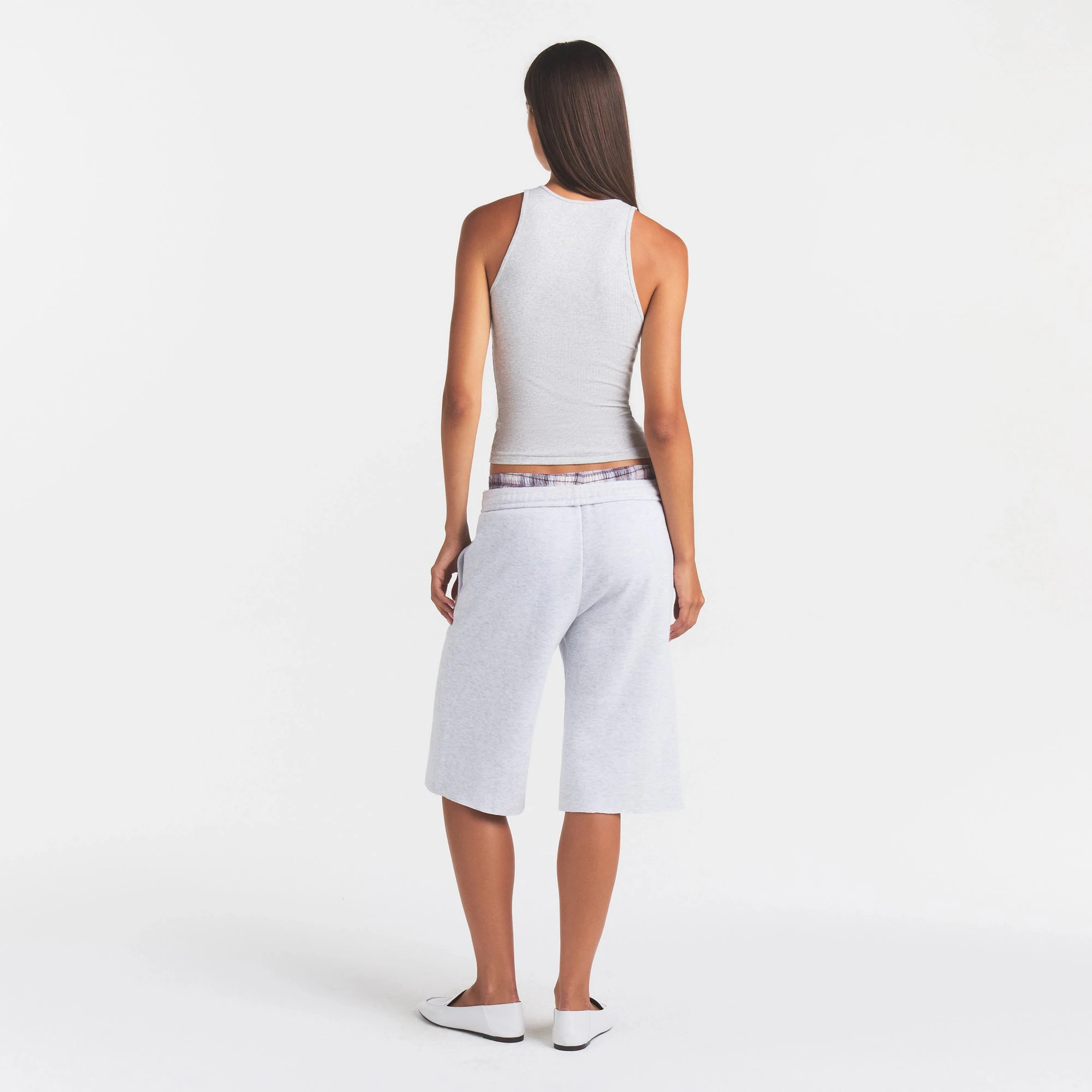 COTTON FLEECE LONG SHORT | LIGHT HEATHER GREY ON A MODEL FRONT VIEW
