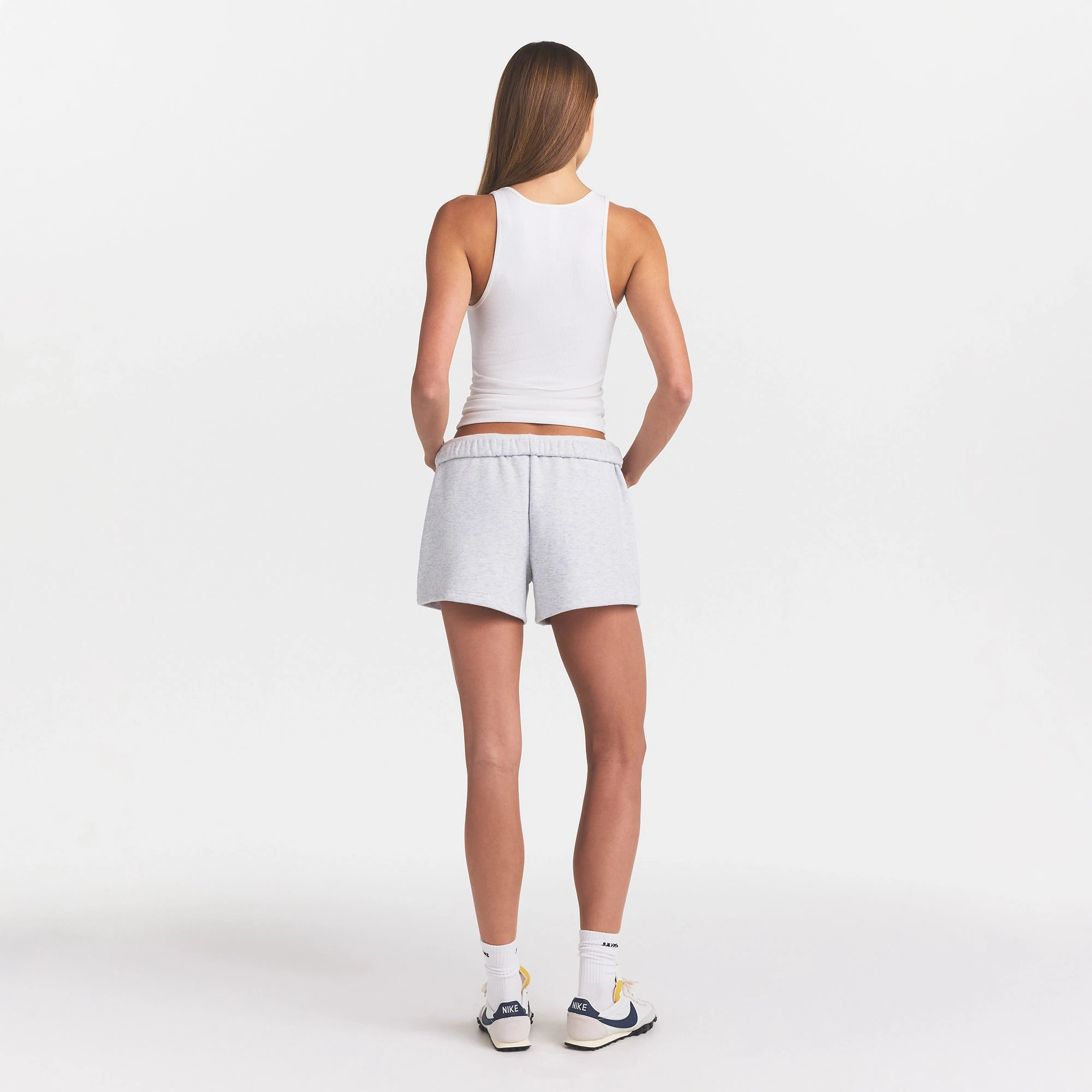 COTTON FLEECE CLASSIC SHORT | LIGHT HEATHER GREY ON A MODEL BACK VIEW @ | FOCUS: 0.0, 1.0, 0.9