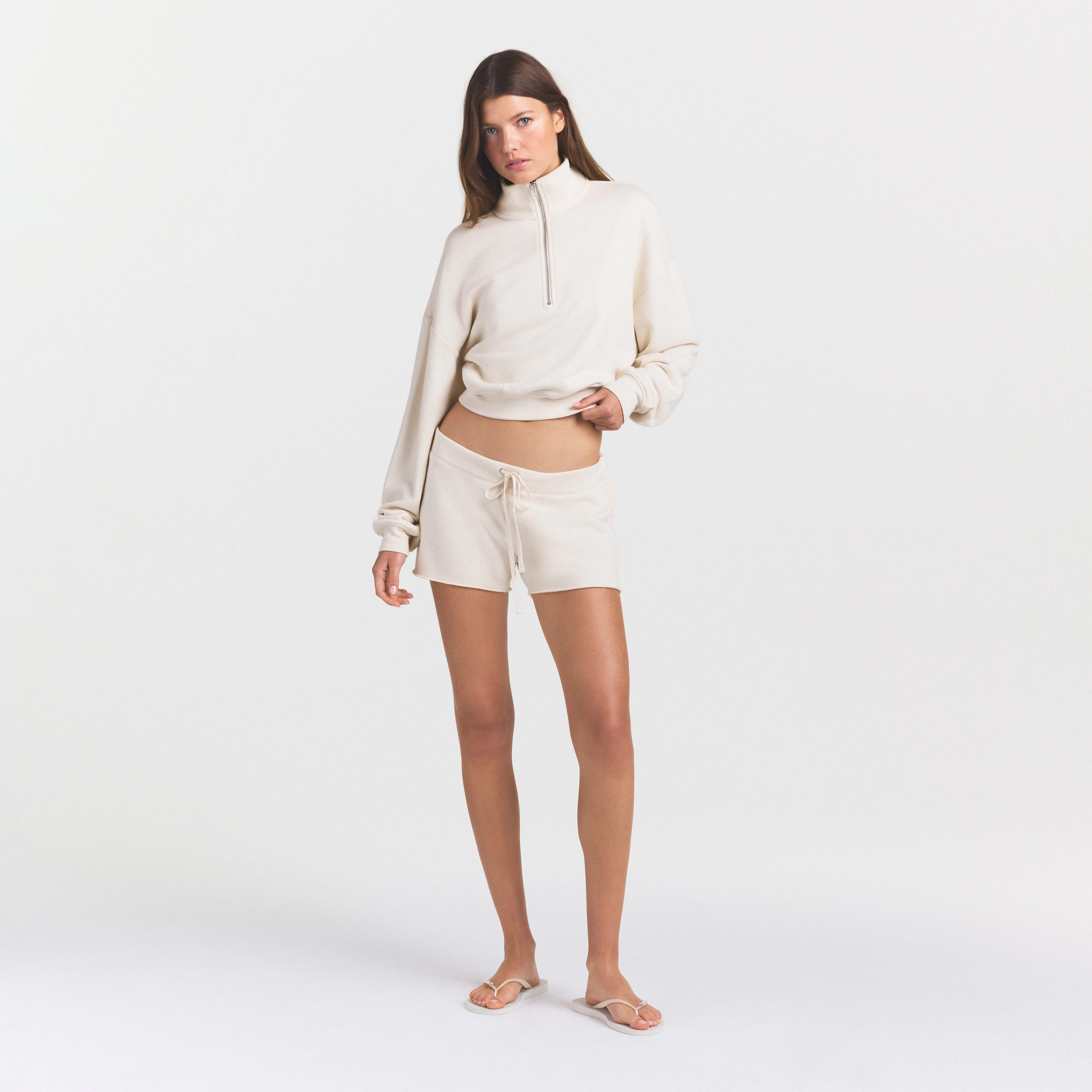 DRAPEY FRENCH TERRY SHORT | BUFF ON A MODEL FRONT VIEW @ | FOCUS: 0.0, 1.0, 0.9