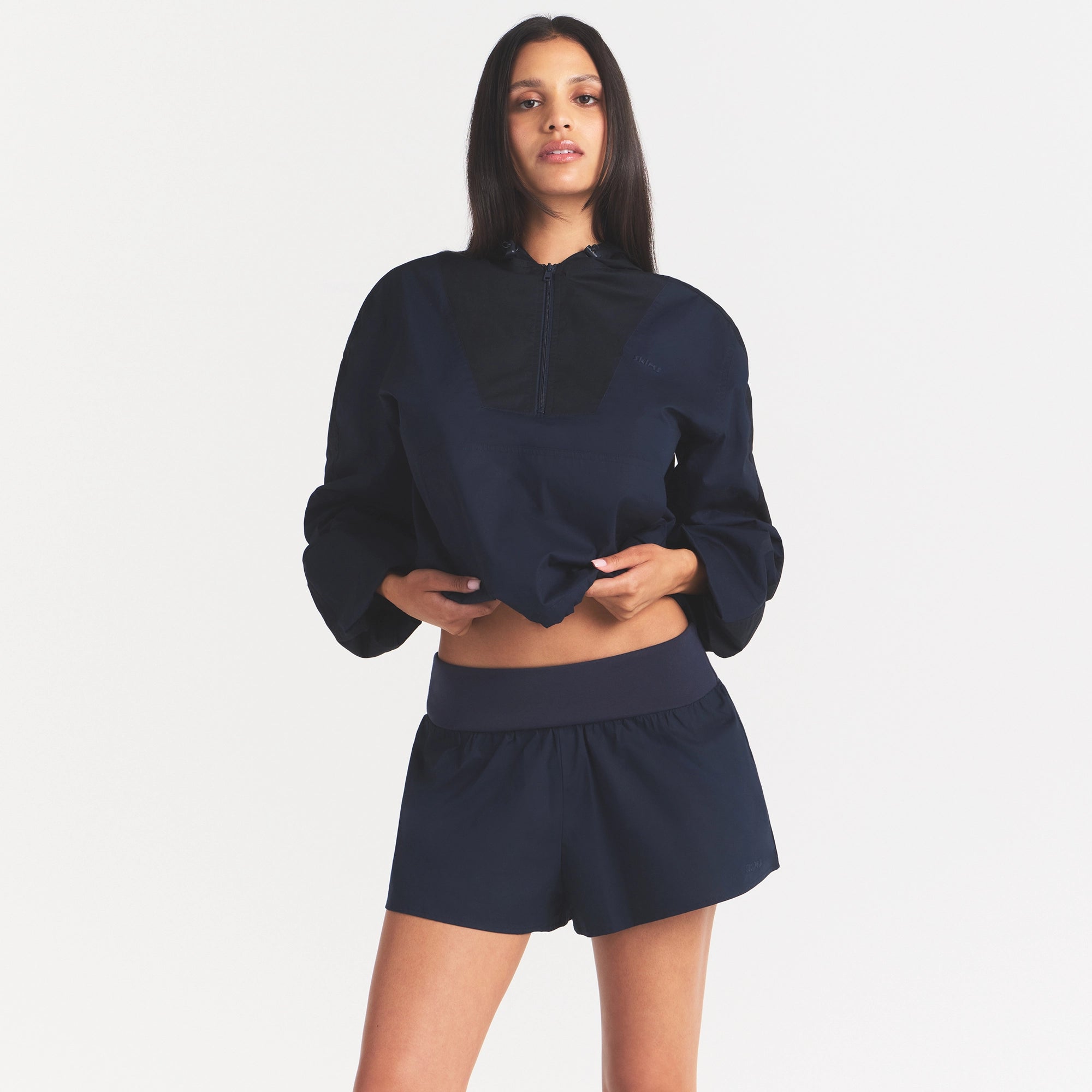 WOVEN COTTON FLUTTER SHORT | NAVY ON A MODEL SIDE VIEW @ | FOCUS: 0.0, 1.0, 0.9