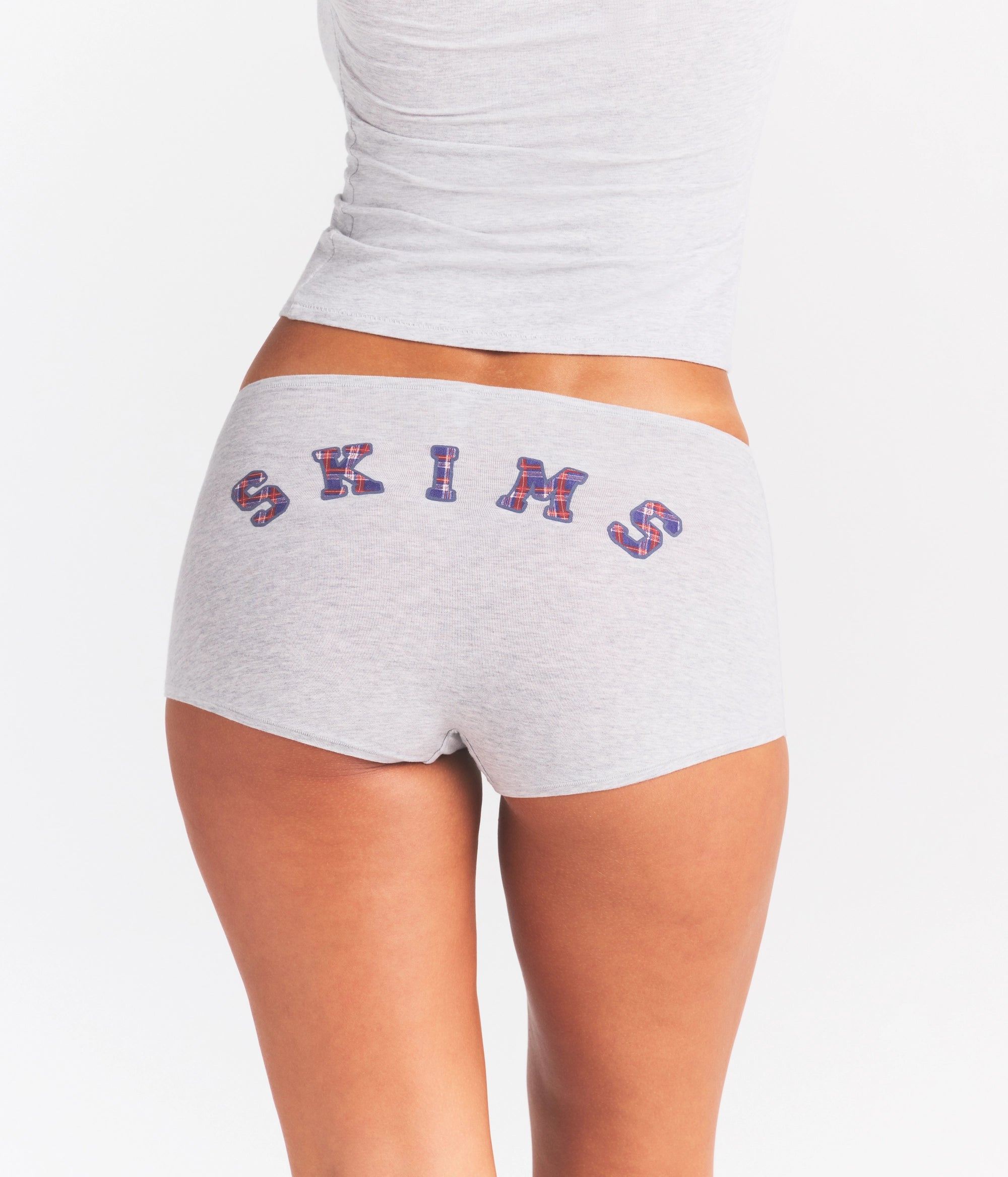 COTTON JERSEY LOGO BOY SHORT | LHG ARCHED SKIMS PLAID & LAYS FLAT ON A WHITE BACKGROUND | FLT @ | FOCUS: 0.0, 1.0, 0.9