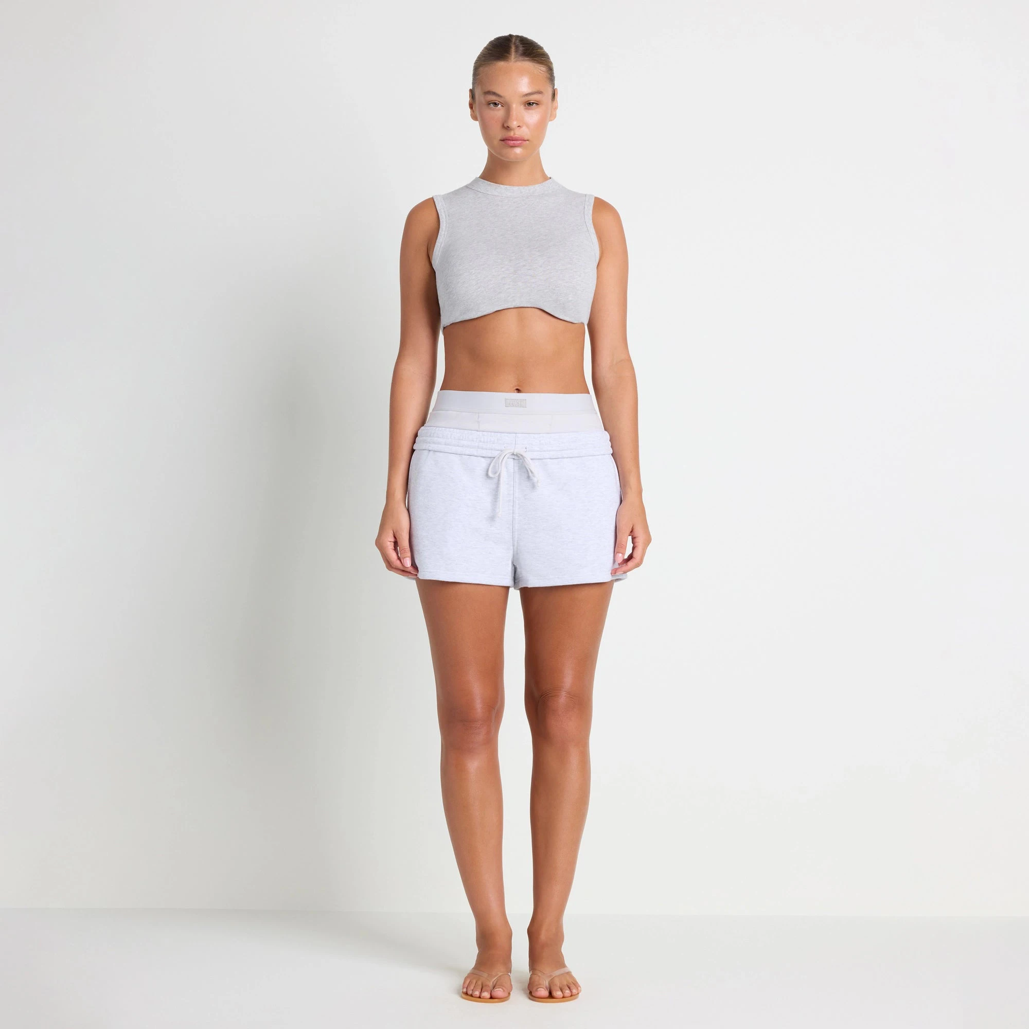 COTTON FLEECE DOUBLE WAISTBAND SHORT | LIGHT HEATHER GREY ON A MODEL FRONT VIEW@| FOCUS: 0.0, 1.0, 0.9