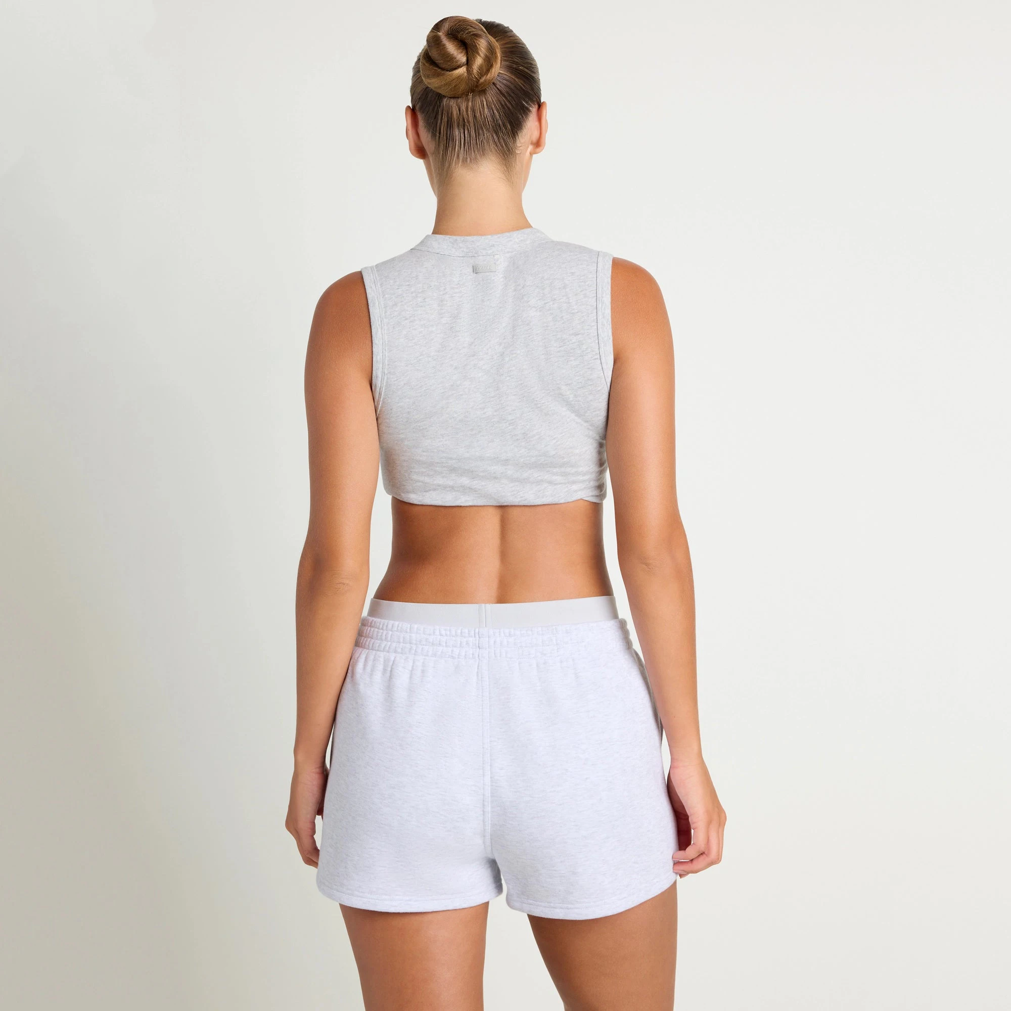COTTON FLEECE DOUBLE WAISTBAND SHORT | LIGHT HEATHER GREY ON A MODEL SIDE VIEW@| FOCUS: 0.0, 1.0, 0.9