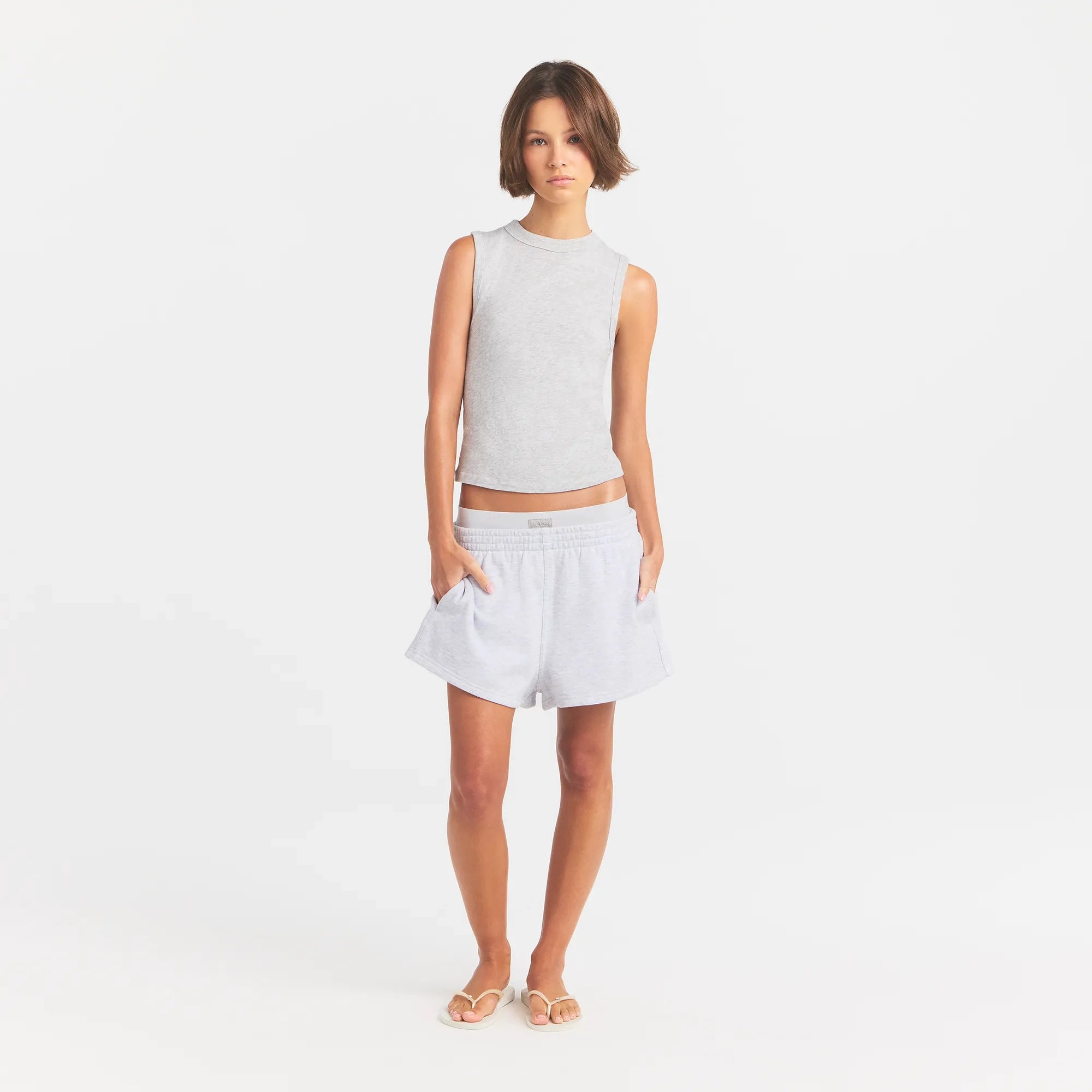 COTTON FLEECE OVERSIZED DOUBLE WAISTBAND SHORT | LIGHT HEATHER GREY ON A MODEL FRONT VIEW @ | FOCUS: 0.0, 1.0, 0.9