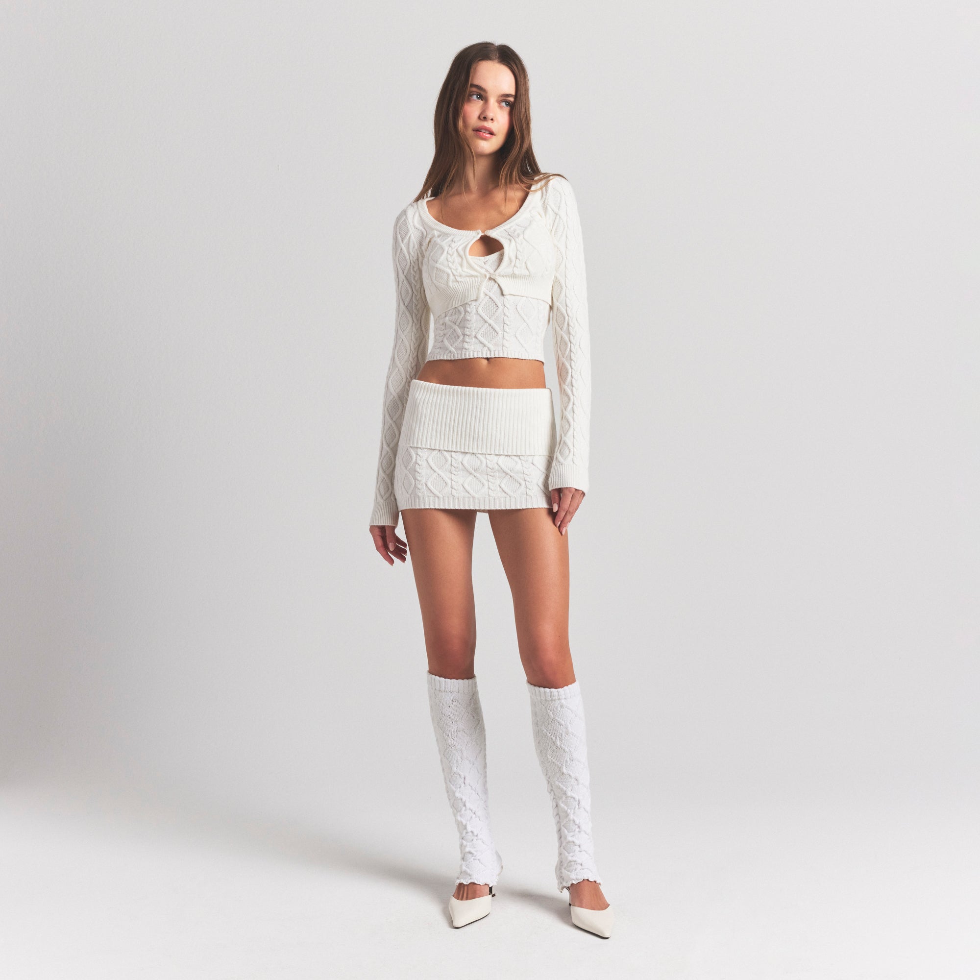 SWEATER KNITS CABLE MINI SKIRT | IVORY ON A MODEL FRONT VIEW @ | FOCUS: 0.0, 1.0, 0.9