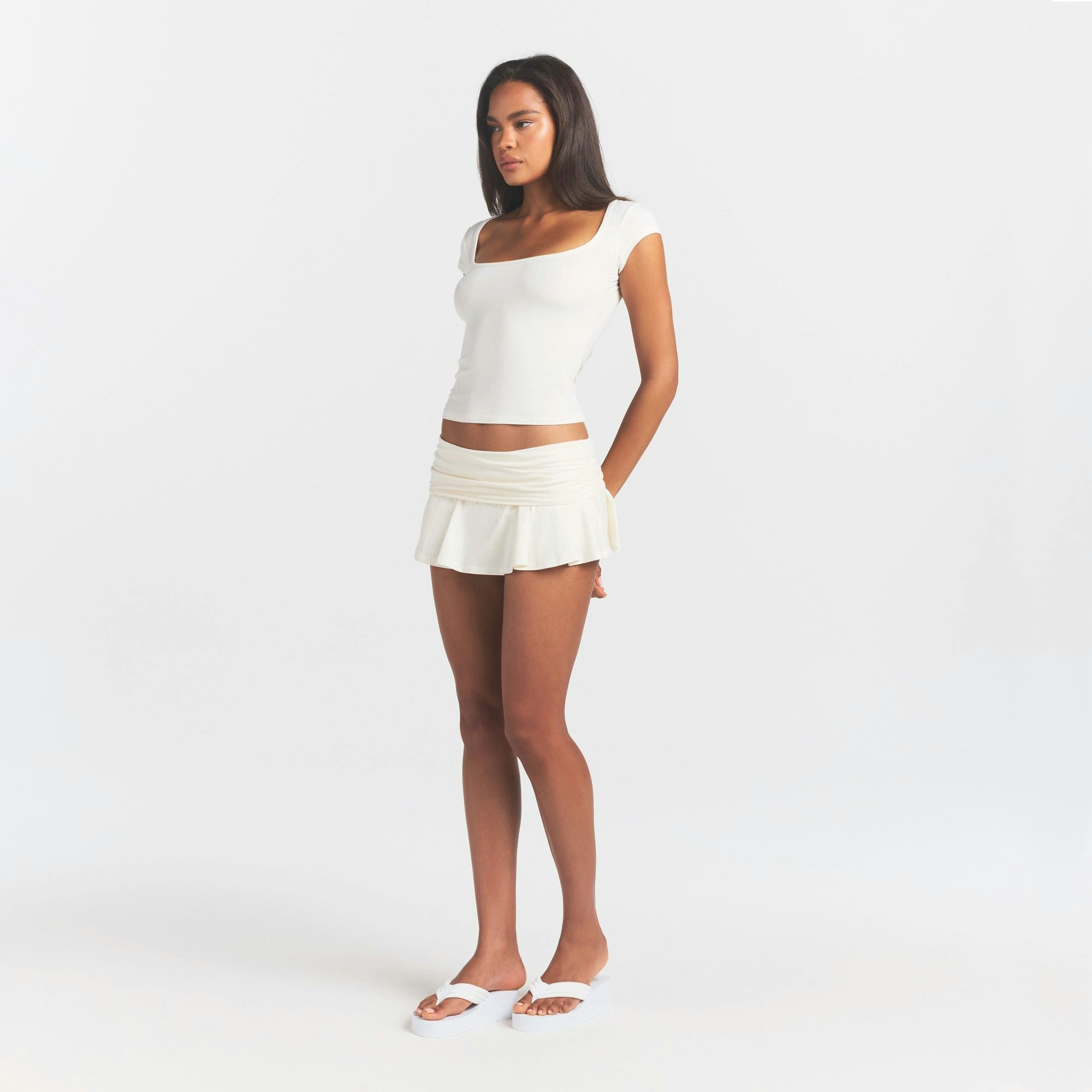 COTTON JERSEY FOLDOVER MINI SKORT | MARBLE ON A MODEL SIDE VIEW