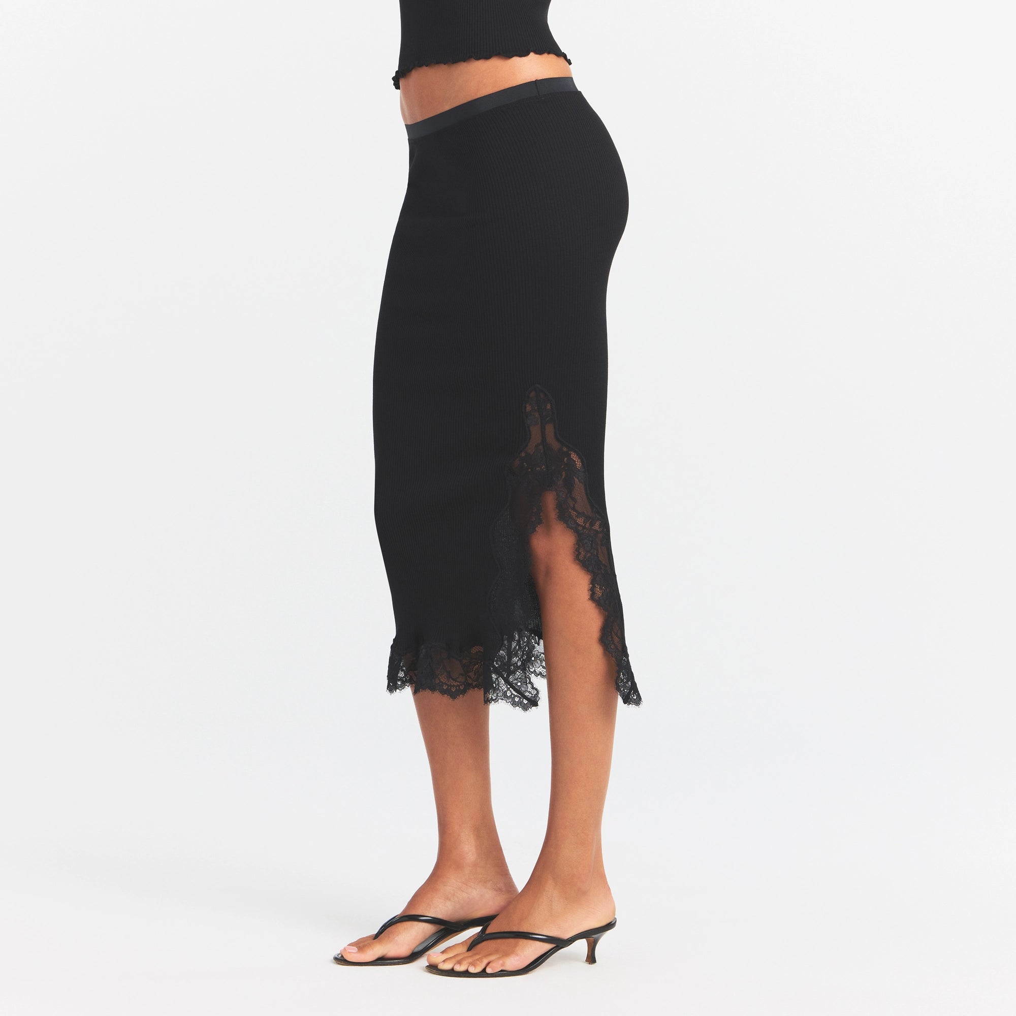RIB KNIT LACE MIDI SKIRT | OBSIDIAN ON A MODEL SIDE VIEW @ | FOCUS: 0.0, 1.0, 0.9