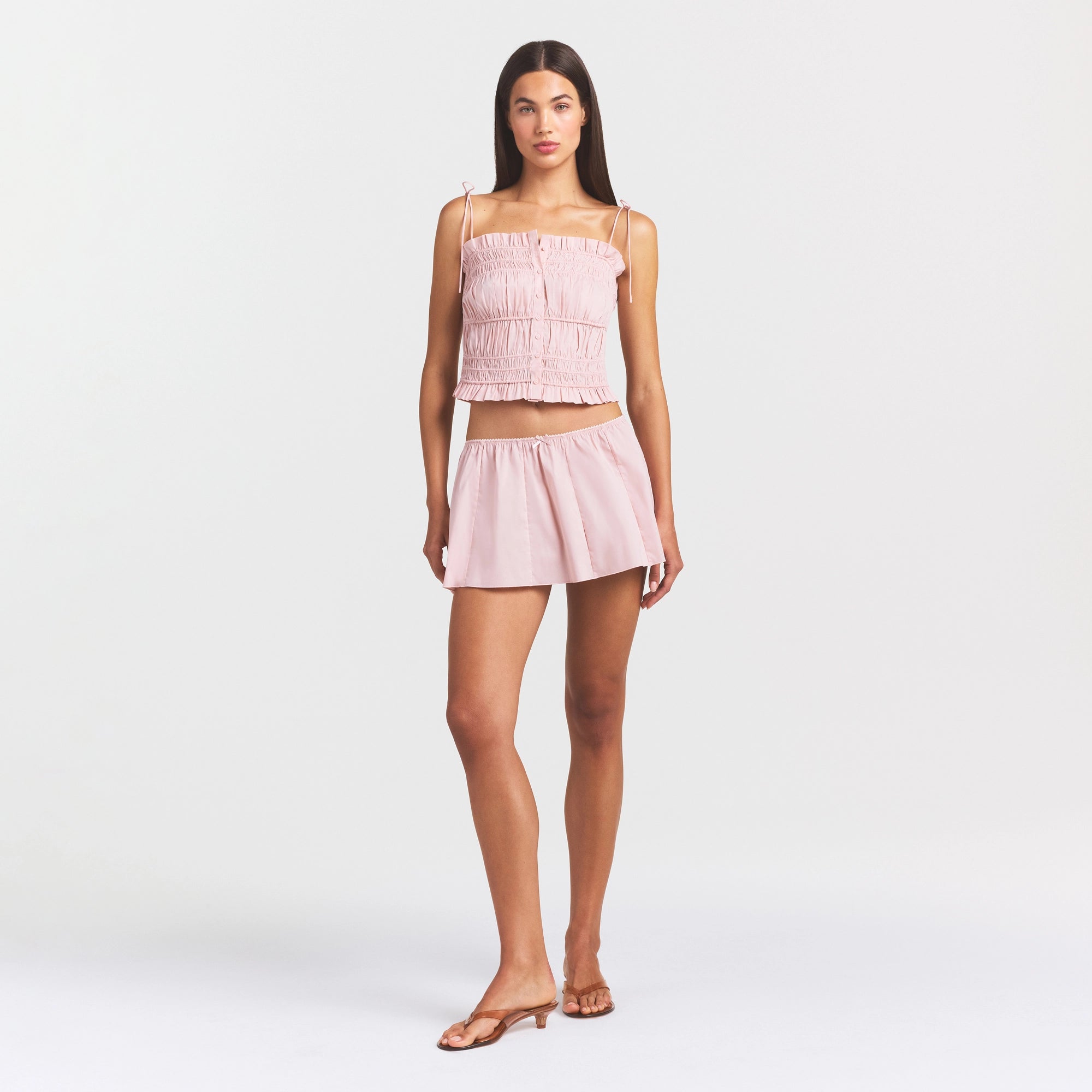 COTTON POPLIN MINI SKIRT | DUSTY PINK ON A MODEL FRONT VIEW @ | FOCUS: 0.0, 1.0, 0.9