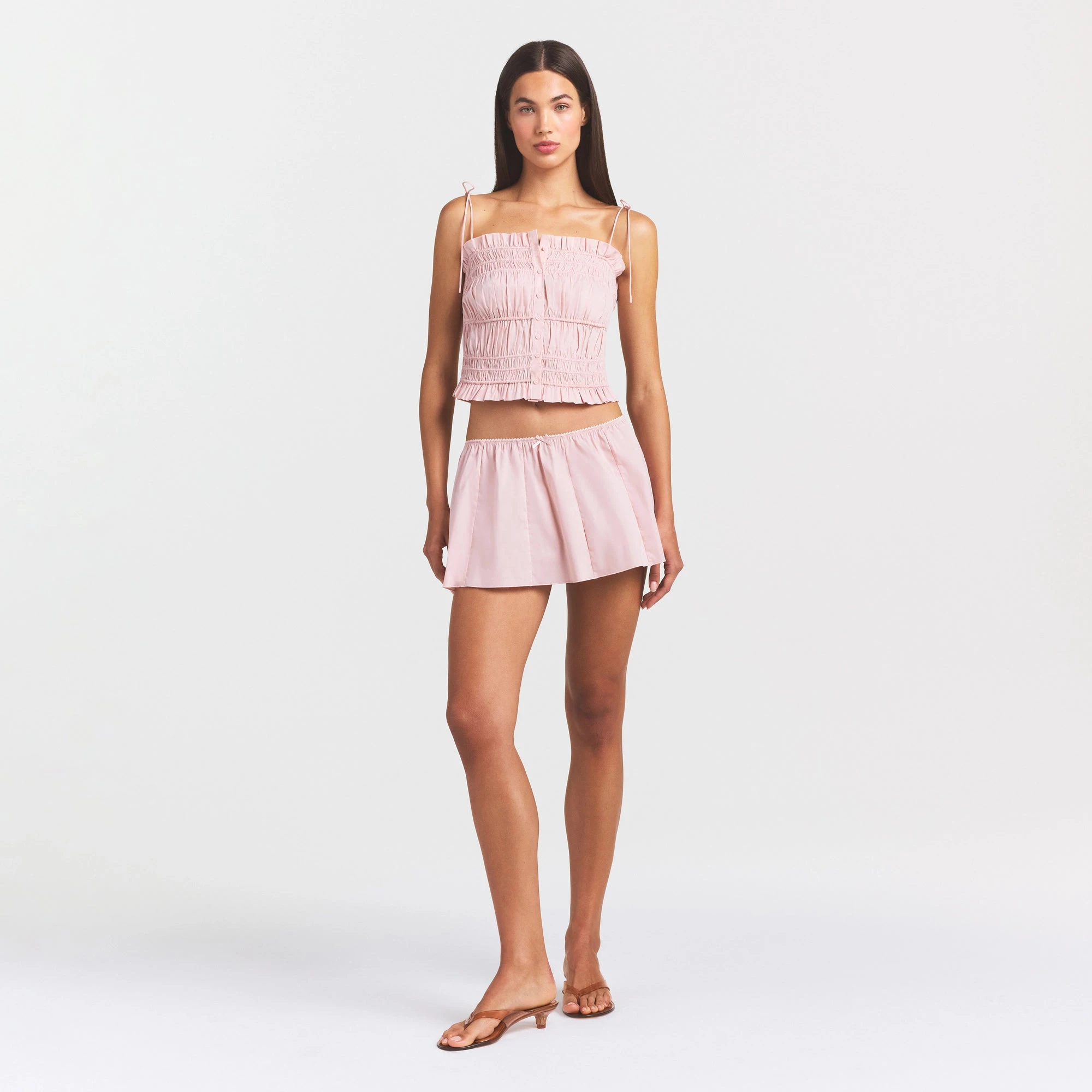 COTTON POPLIN MINI SKIRT | DUSTY PINK ON A MODEL FRONT VIEW