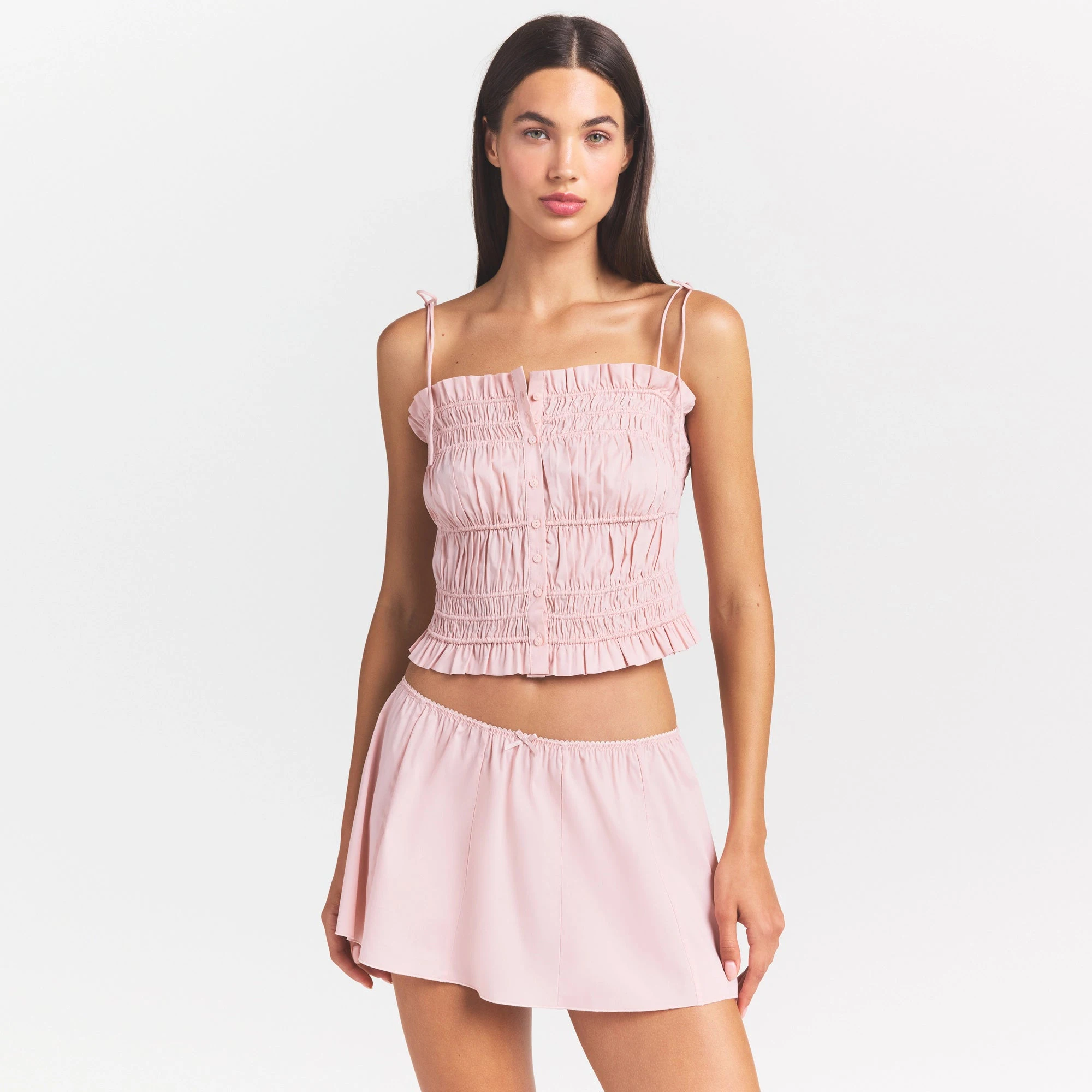 COTTON POPLIN MINI SKIRT | DUSTY PINK ON A MODEL SIDE VIEW