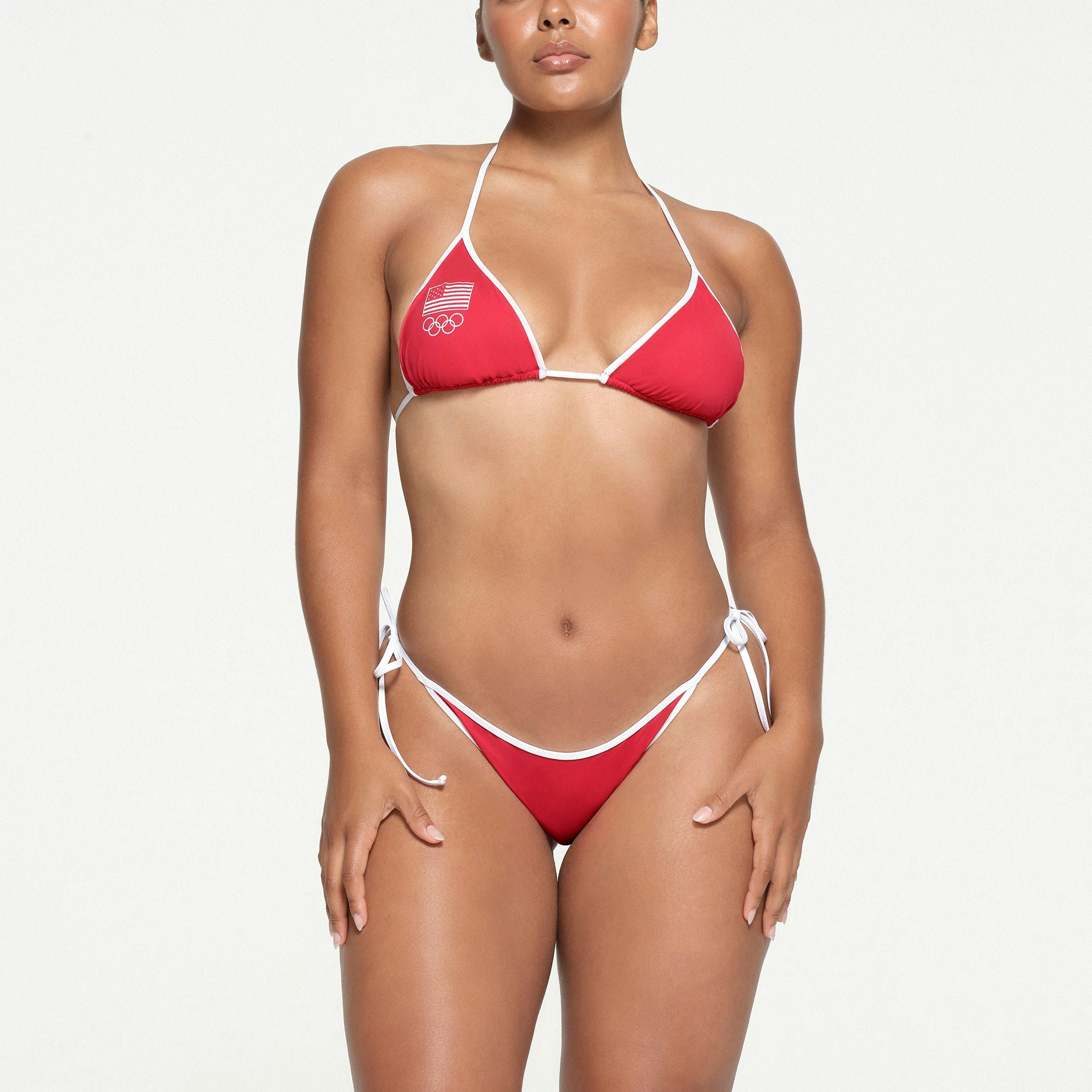 SKIMS FOR TEAM USA SIGNATURE SWIM OLYMPIC TRIANGLE TOP | RED ON A MODEL FRONT VIEW