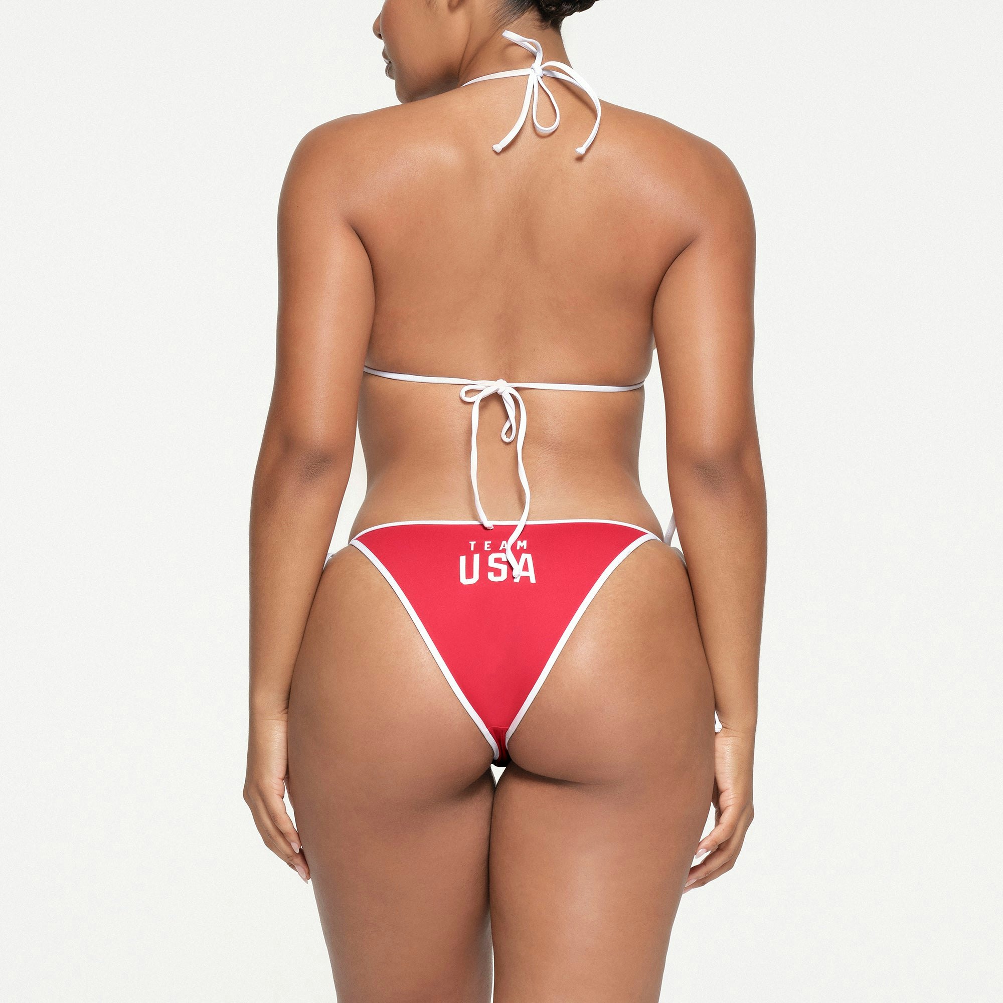 SKIMS FOR TEAM USA SIGNATURE SWIM OLYMPIC TRIANGLE TOP | RED ON A MODEL BACK VIEW
