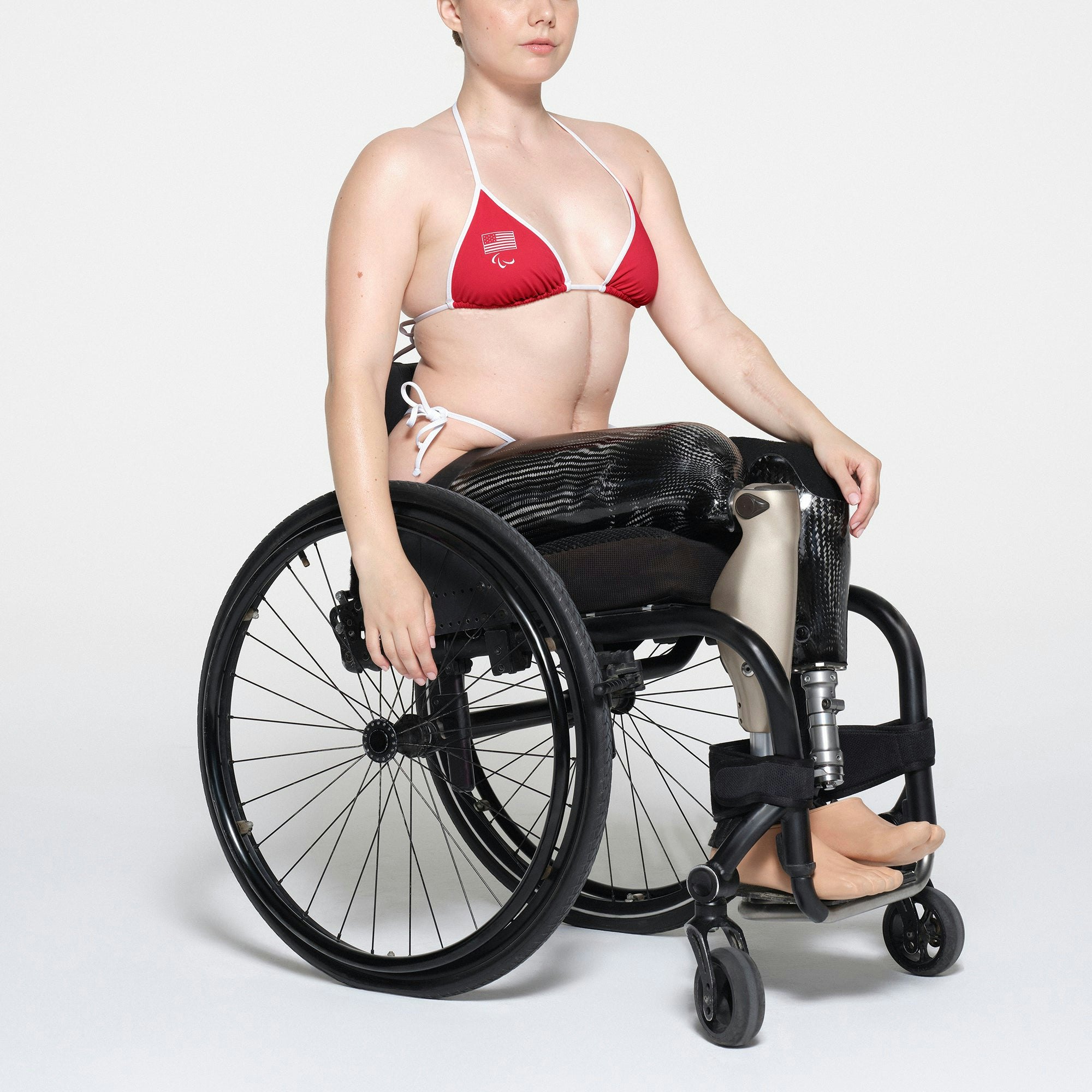 SKIMS FOR TEAM USA SIGNATURE SWIM PARALYMPIC TRIANGLE TOP | RED ON A MODEL SIDE VIEW