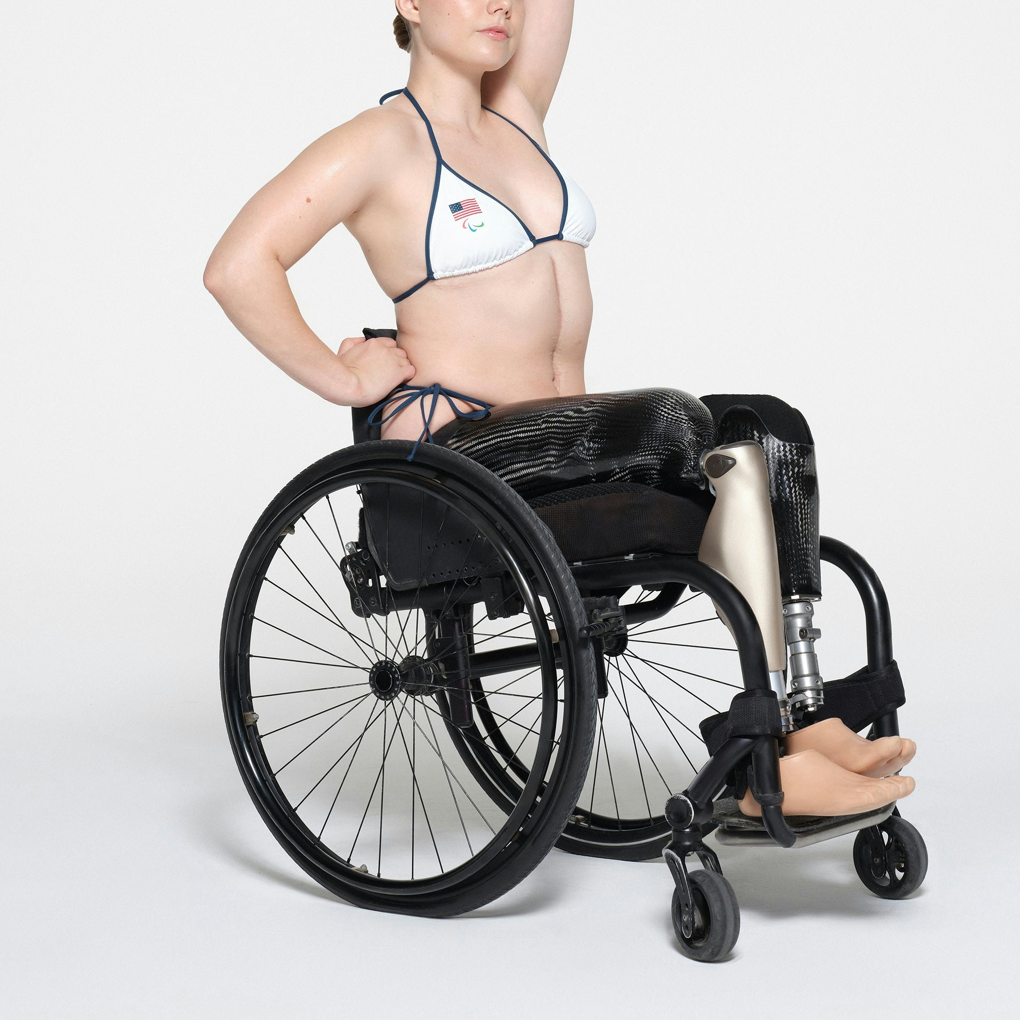 SKIMS FOR TEAM USA SIGNATURE SWIM PARALYMPIC TRIANGLE TOP | WHITE ON A MODEL SIDE VIEW