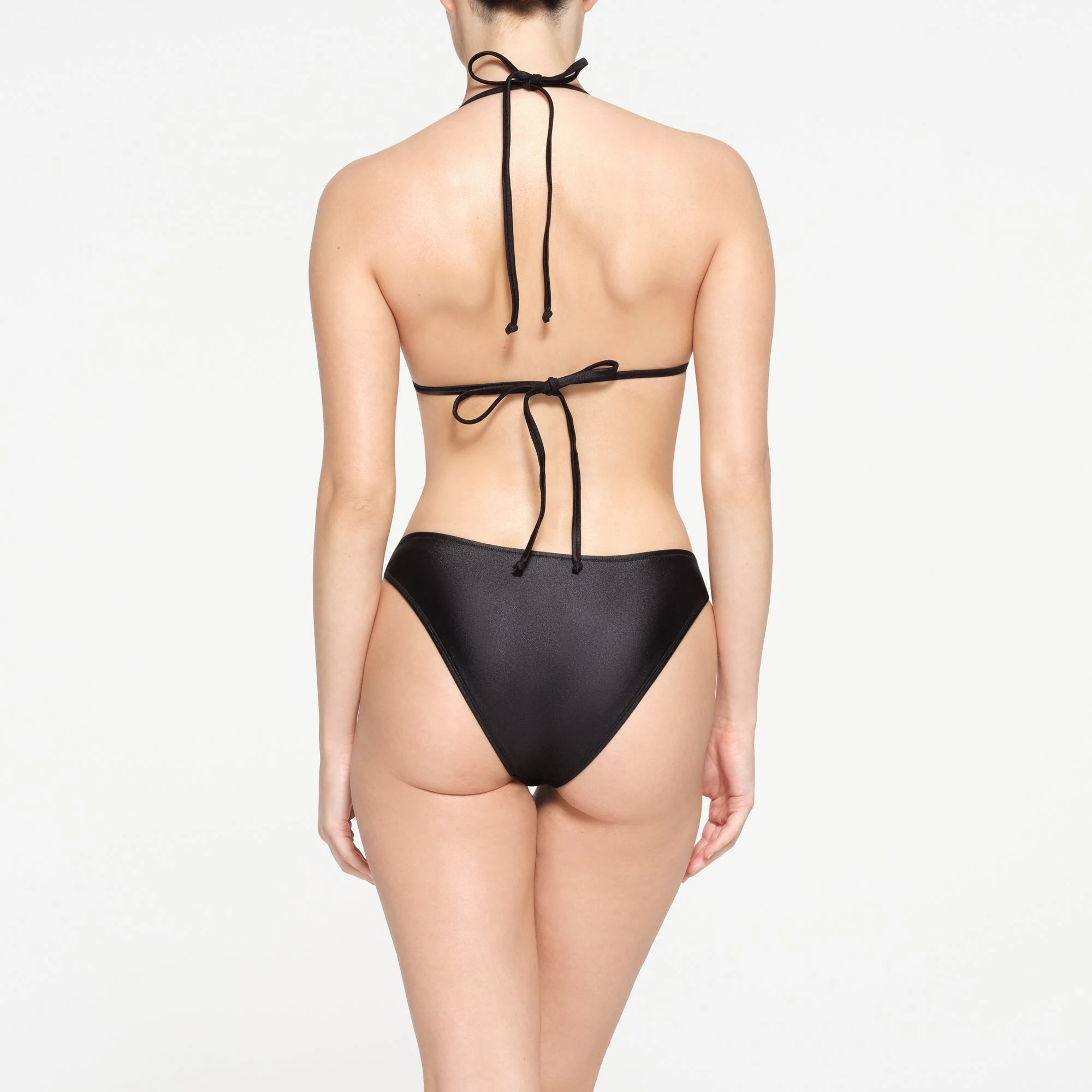 SHINE SWIM TRIANGLE TOP | ONYX ON A MODEL BACK VIEW