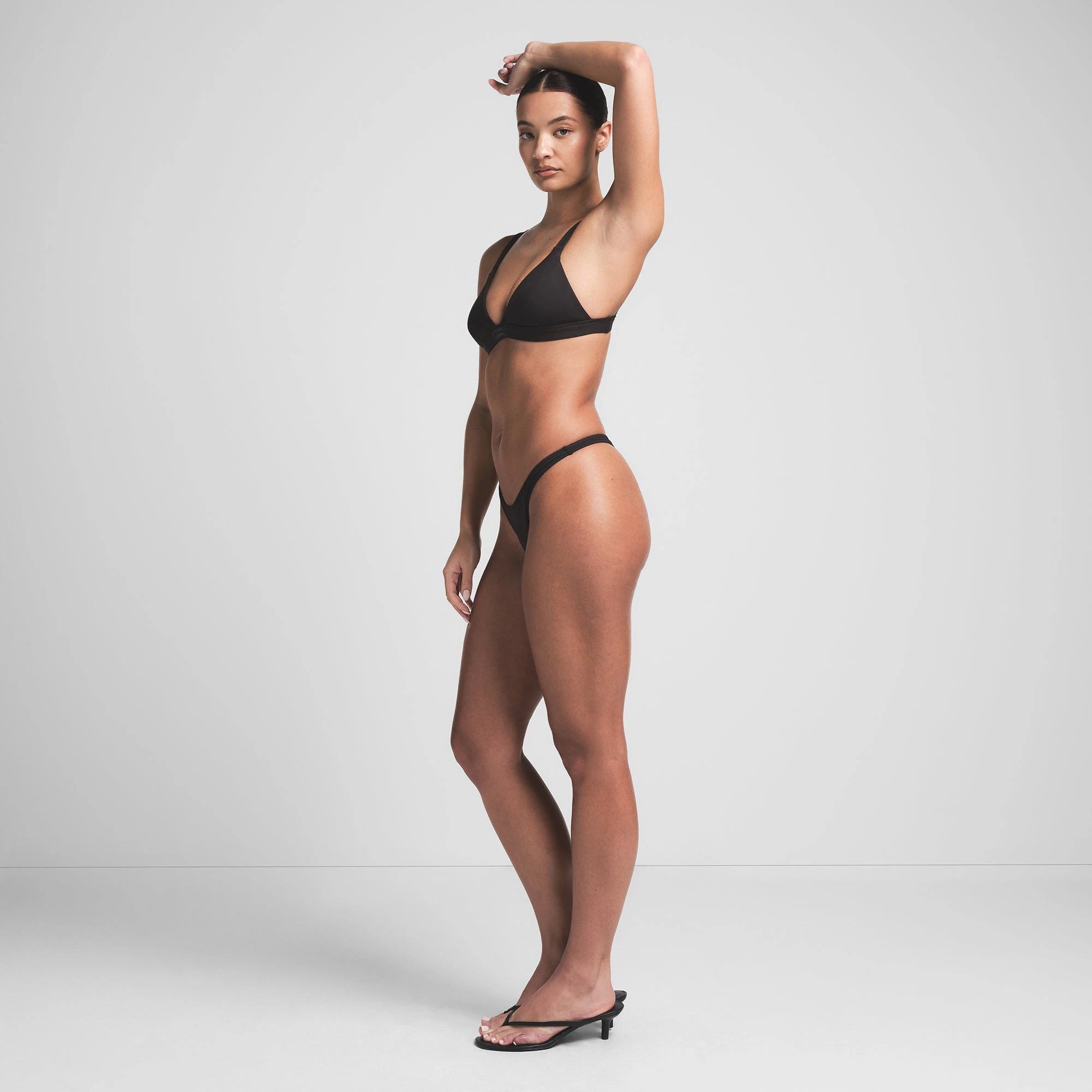 SIGNATURE SWIM FIXED TRIANGLE BIKINI TOP | ONYX ON A MODEL SIDE VIEW | FOCUS: 0.0, 1.0, 0.9