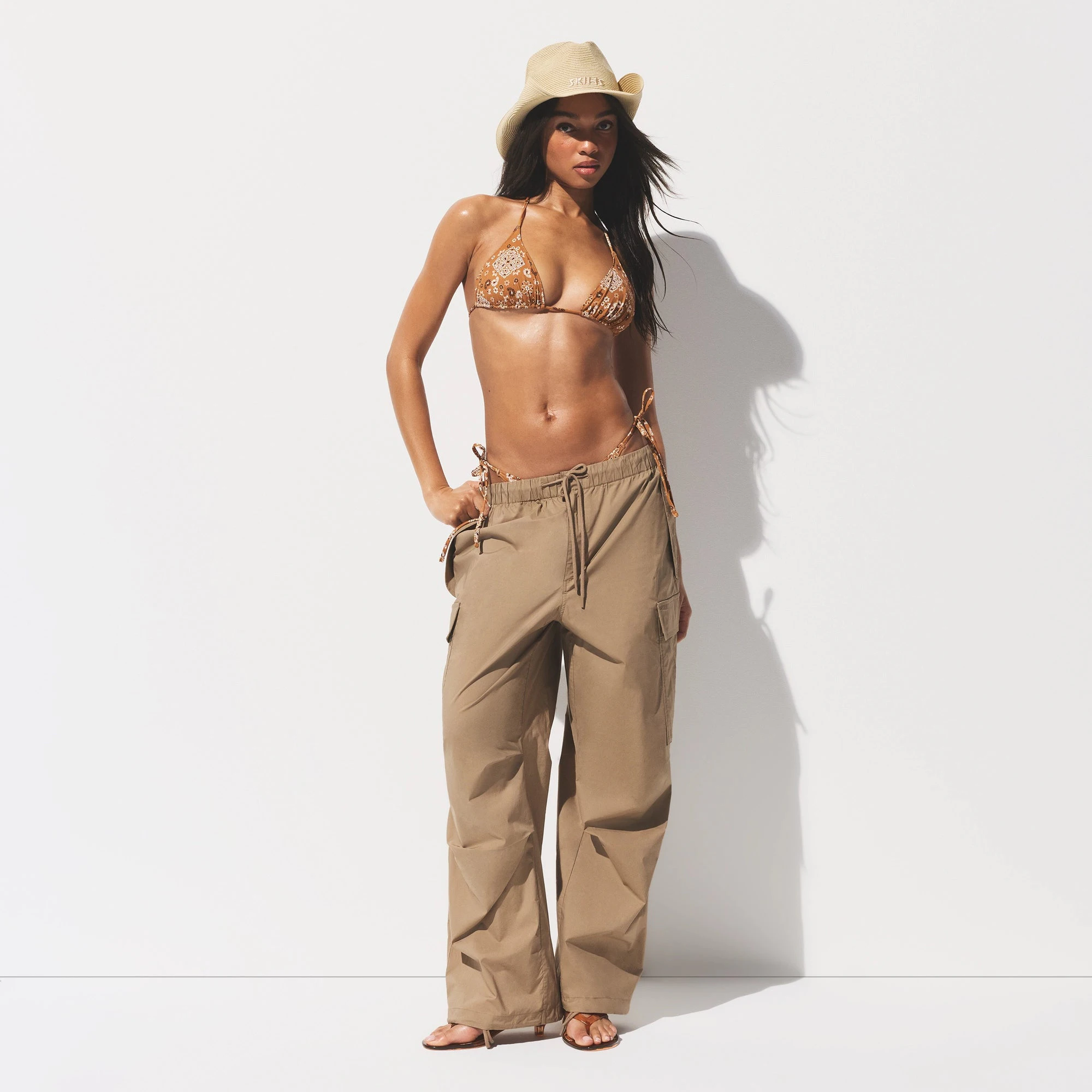 SIGNATURE SWIM TRIANGLE BIKINI TOP | ALMOND BANDANA ON A MODEL FRONT VIEW @ | FOCUS: 0.0, 1.0, 0.9