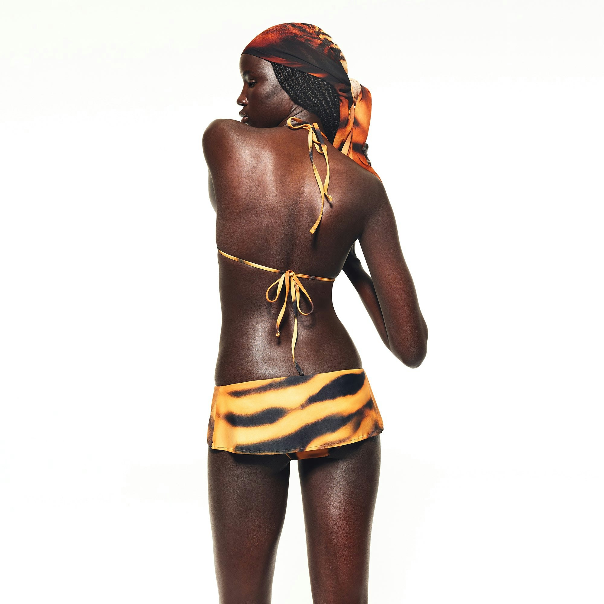 ROBERTO CAVALLI X SKIMS TRIANGLE BIKINI TOP | TIGER FACE PRINT ON A MODEL BACK VIEW | FOCUS: 0.0, 1.0, 0.9