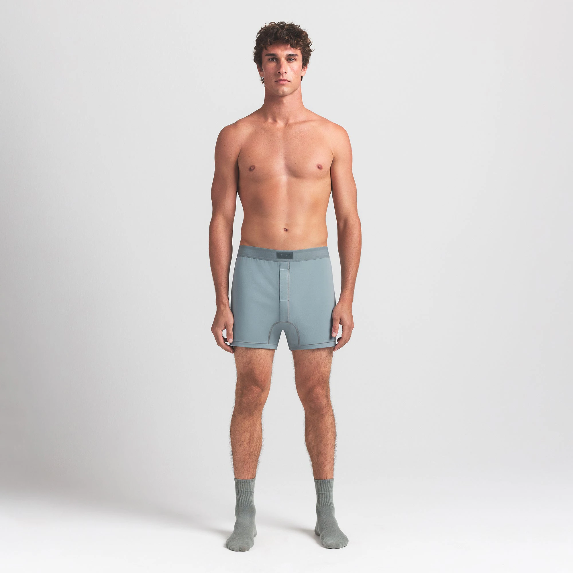 SKIMS COTTON MENS KNIT BOXER | SKY ON A MODEL FRONT VIEW @ | FOCUS: 0.0, 1.0, 0.9