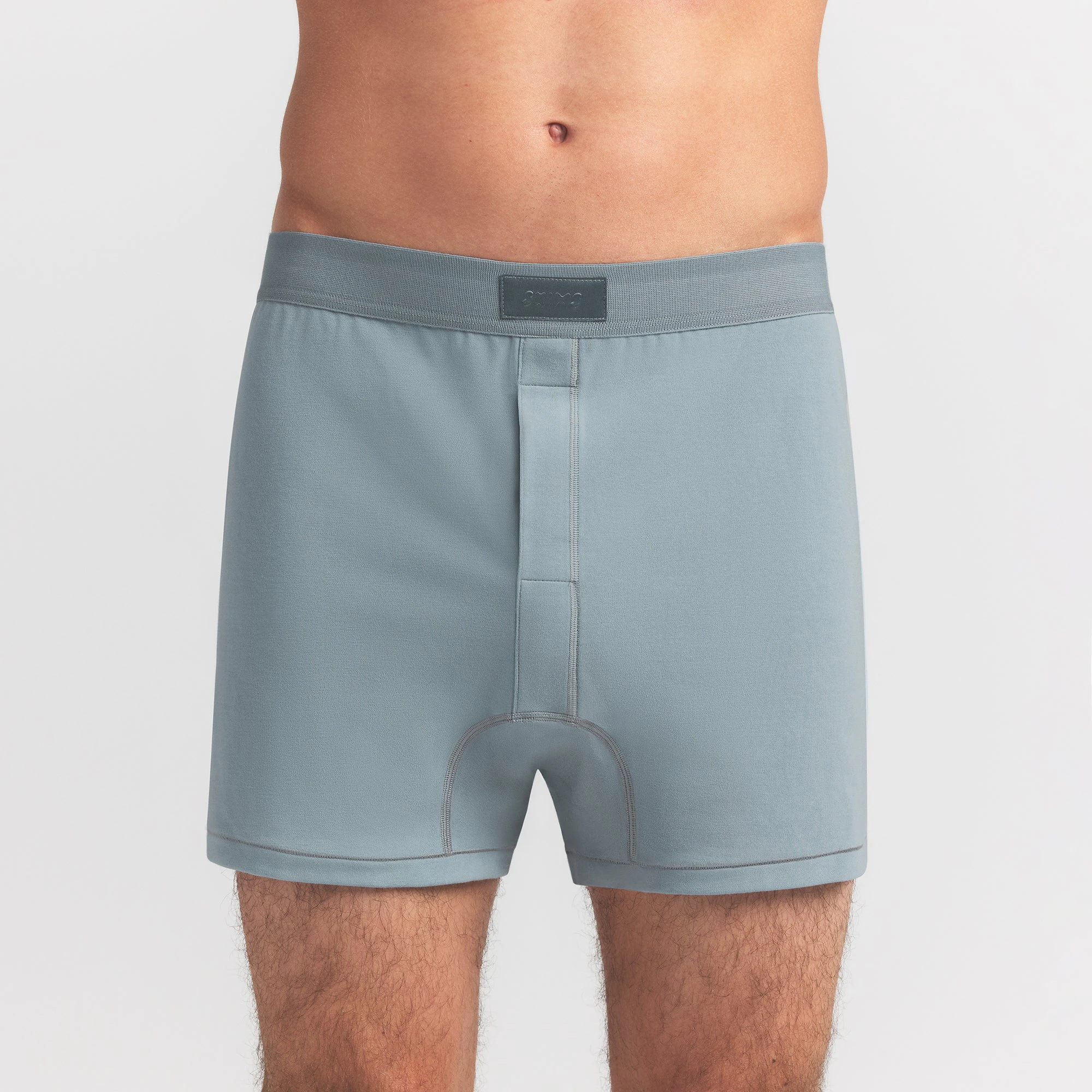 SKIMS COTTON MENS KNIT BOXER | SKY ON A MODEL FRONT VIEW @ | FOCUS: 0.0, 1.0, 0.9