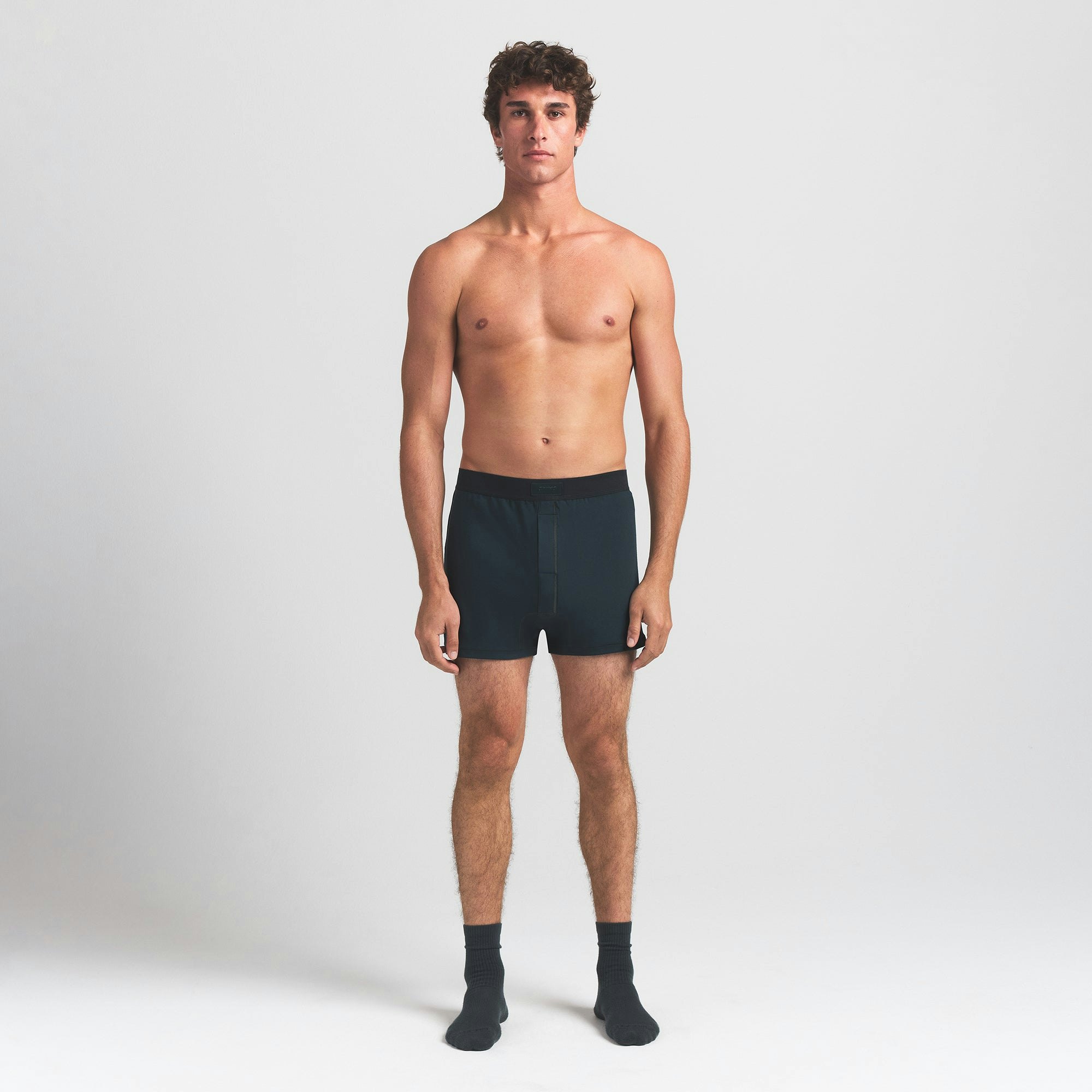 SKIMS COTTON MENS KNIT BOXER | VERDANT ON A MODEL FRONT VIEW @ | FOCUS: 0.0, 1.0, 0.9
