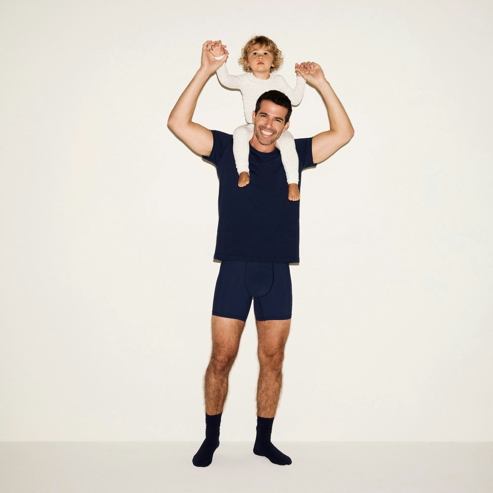 SKIMS SPORT MENS 5 INCH BOXER BRIEF 3-PACK | NAVY SMOKE MULTI ON A WHITE BACKGROUND 