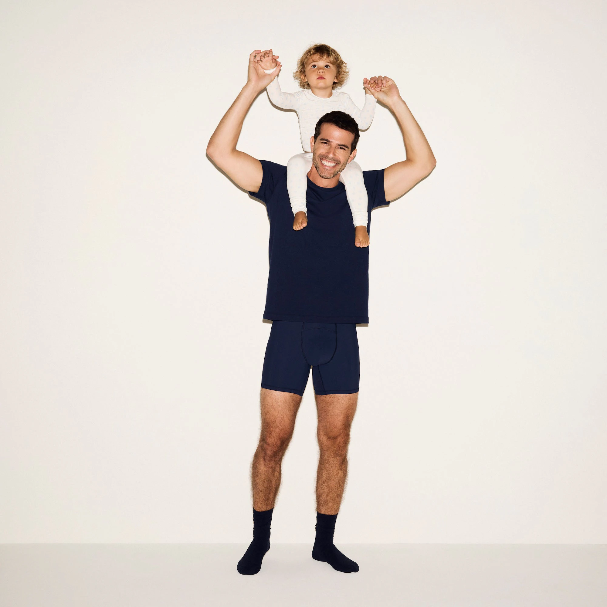 SKIMS SPORT MENS 5 INCH BOXER BRIEF 3-PACK | NAVY SMOKE MULTI ON A WHITE BACKGROUND 