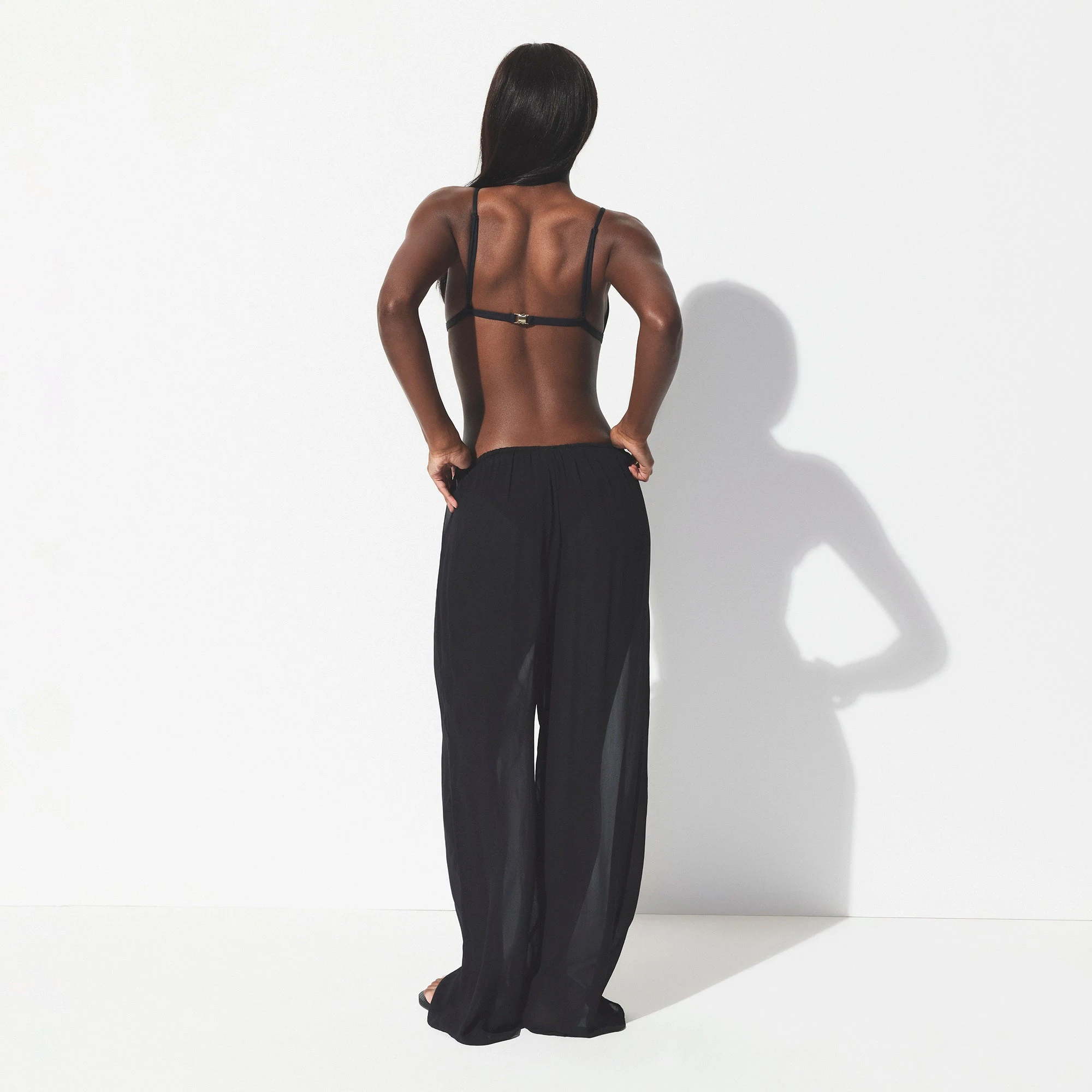 SHEER COVER-UPS PANT | OBSIDIAN ON A MODEL SIDE VIEW @ | FOCUS: 0.0, 1.0, 0.9