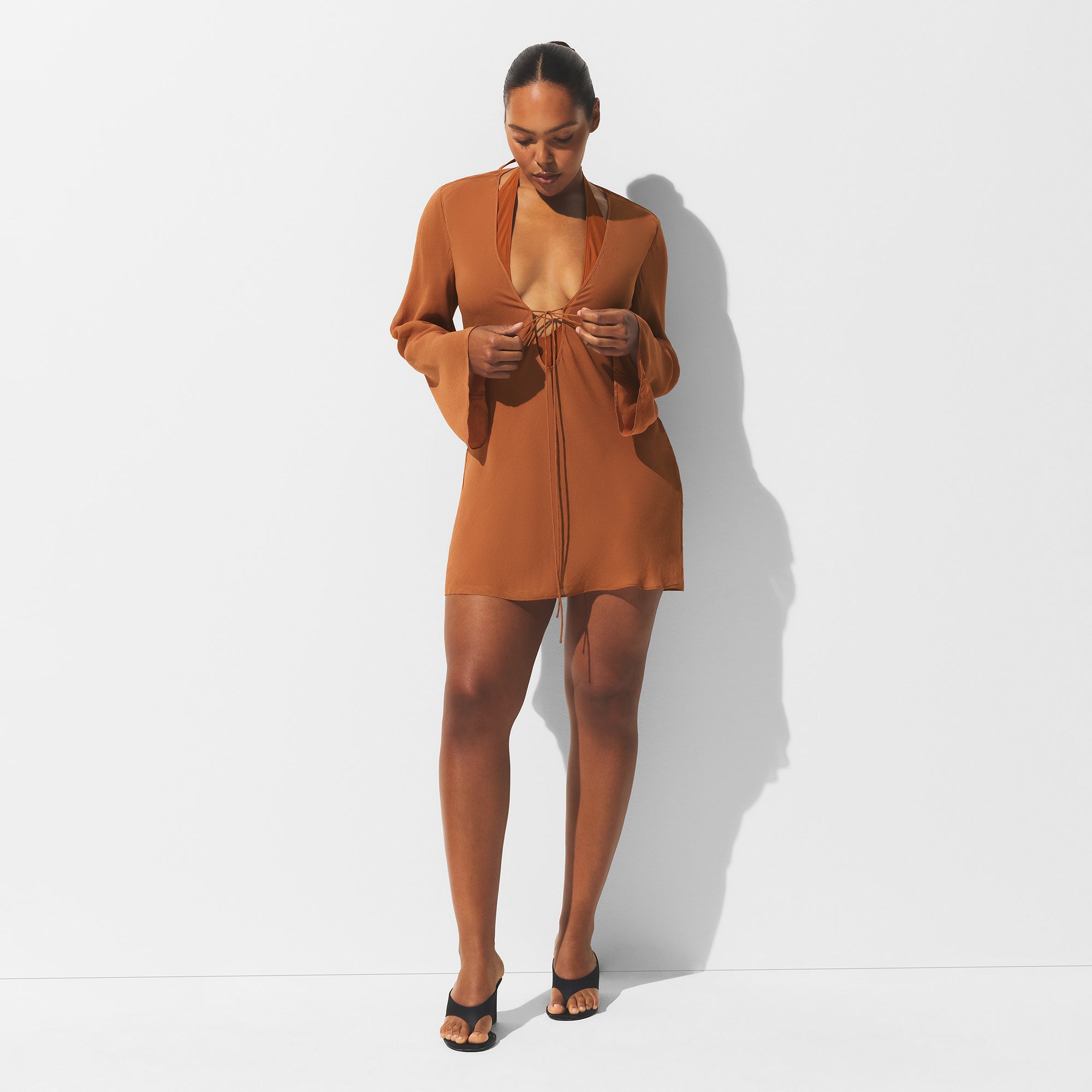 MINIMAL SWIM COVER UP LONG SLEEVE MINI DRESS | CHESTNUT ON A MODEL FRONT VIEW | FOCUS: 0.0, 1.0, 0.9