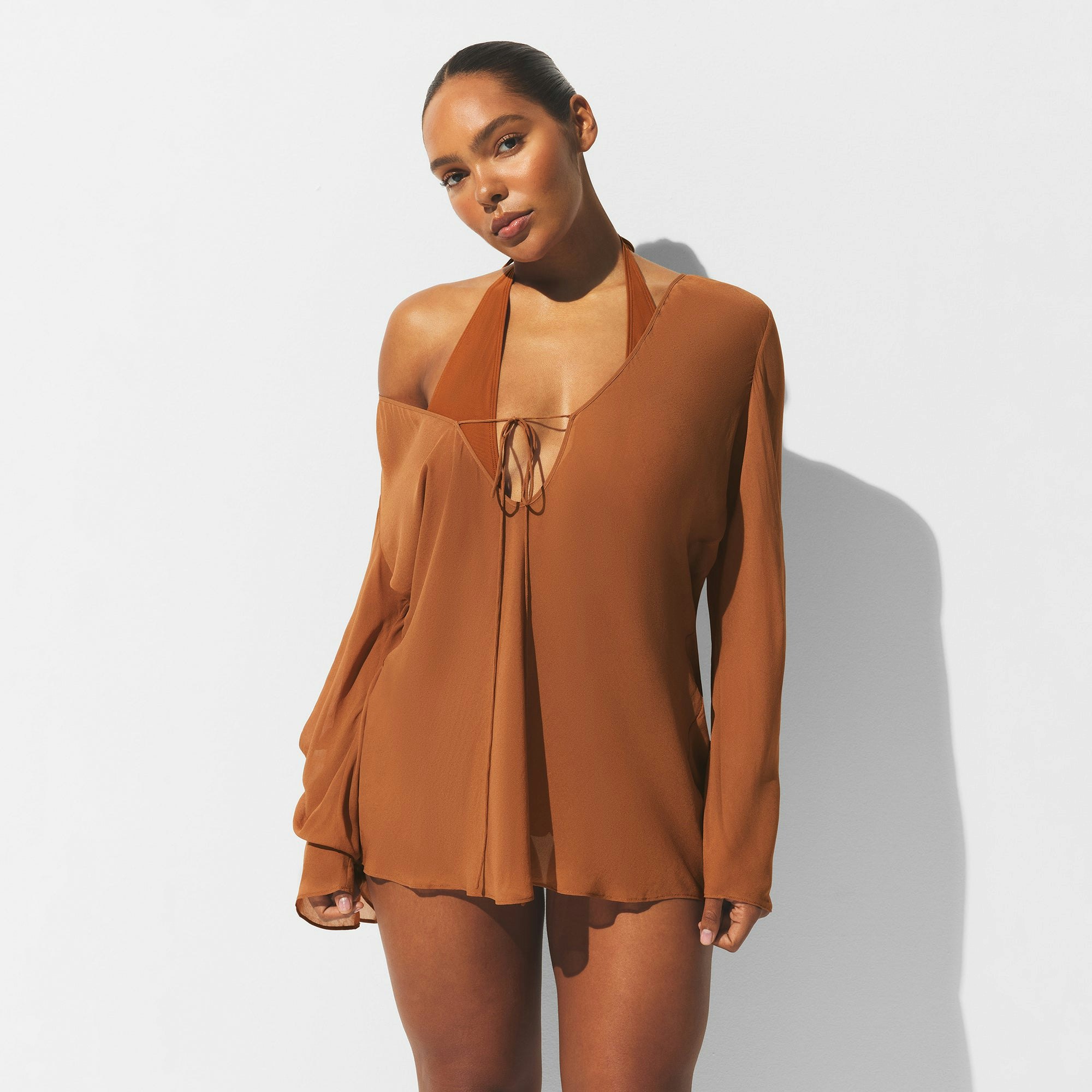 MINIMAL SWIM COVER UP LONG SLEEVE MINI DRESS | CHESTNUT ON A MODEL FRONT VIEW | FOCUS: 0.0, 1.0, 0.9
